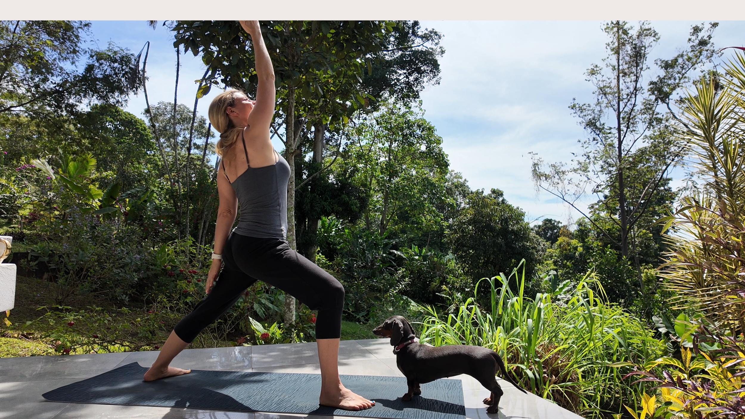 Nina practicing yoga with little dog
