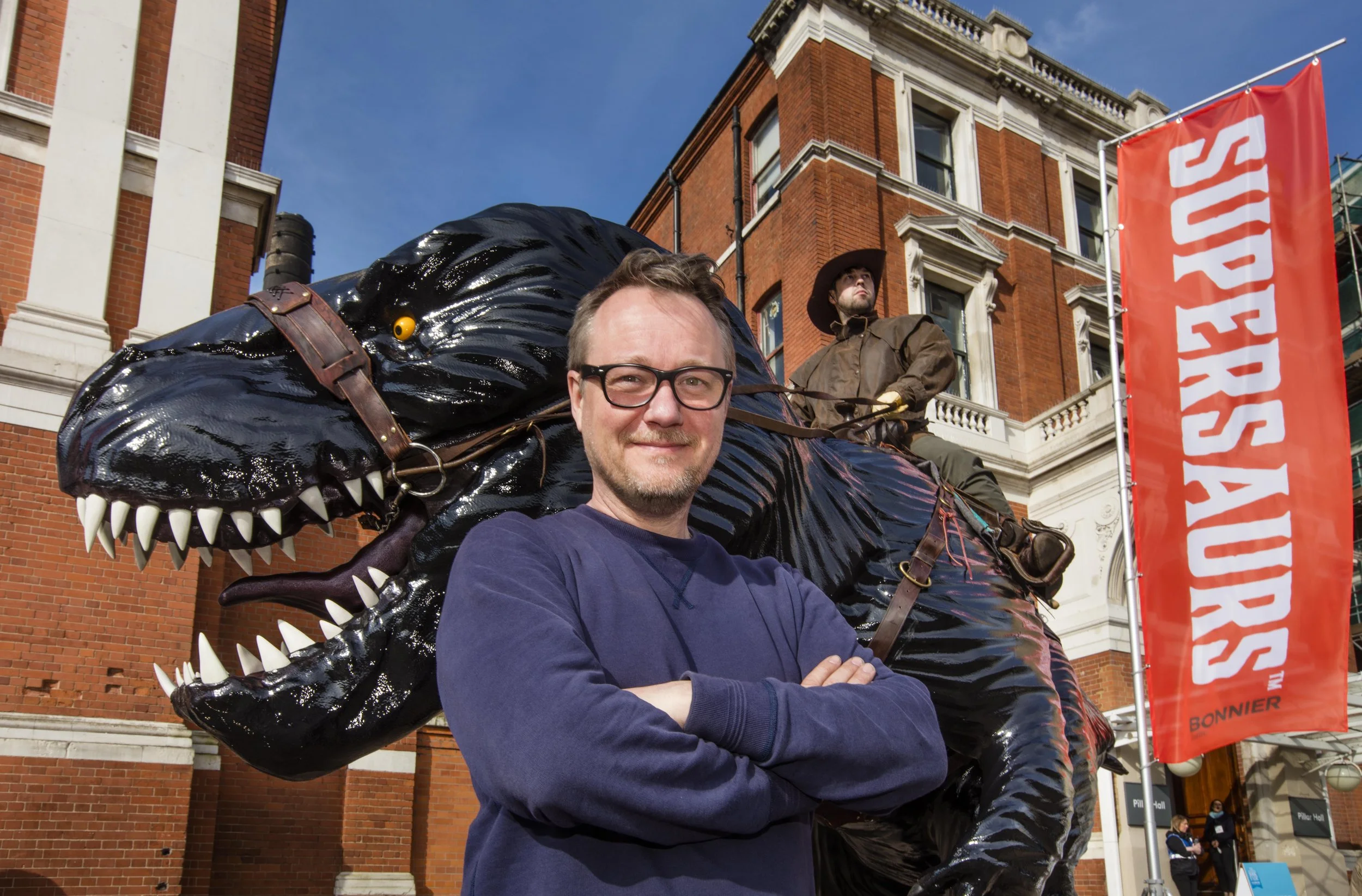 Author and creator Jay Jay Burridge at London Book Fair with life size supersaur.jpg