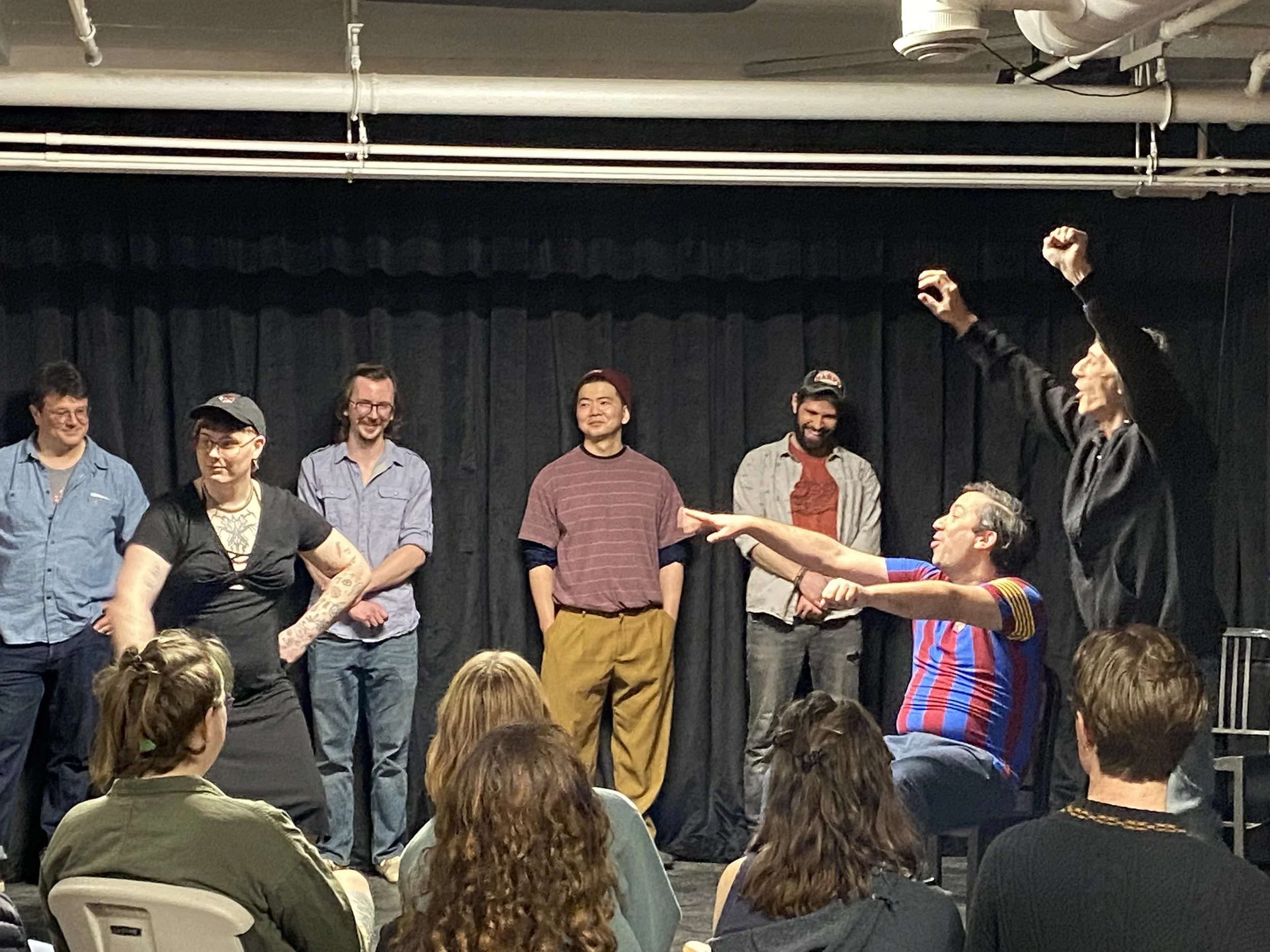 Photo of improvisers of all levels playing and laughing and finding joy on stage.