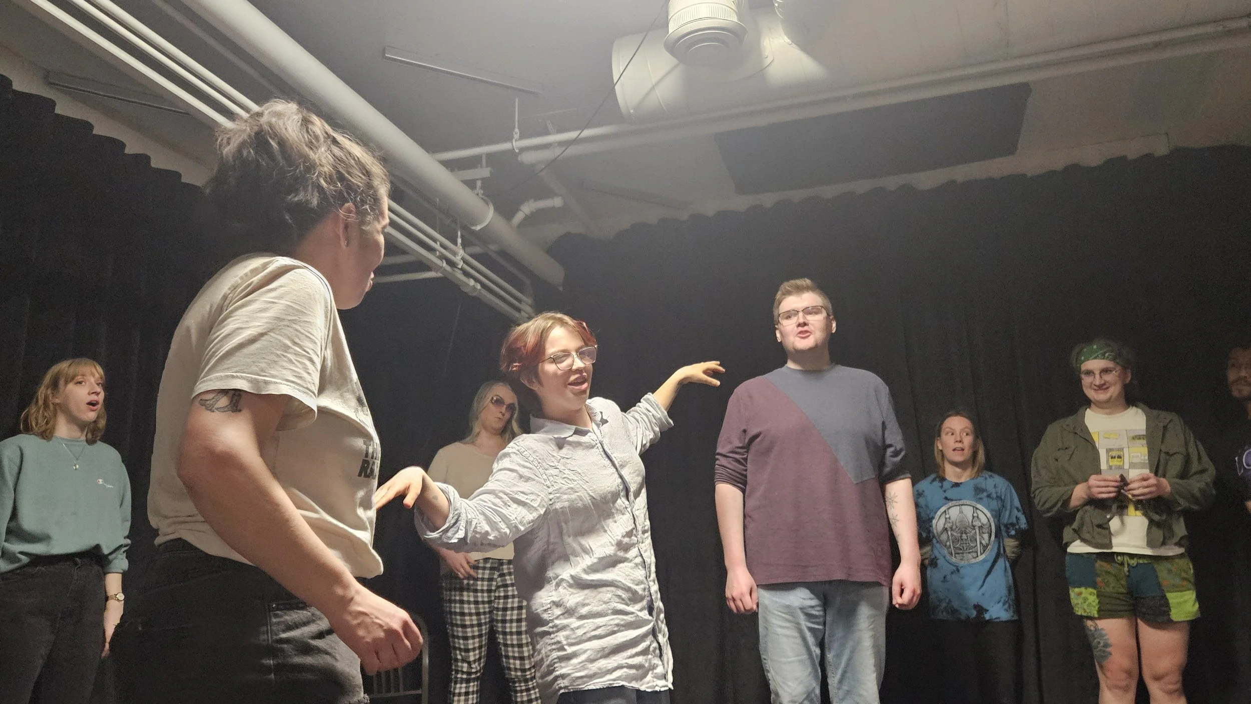 Photos of improvisers of all levels creating interested physicality on stage to showcase character.