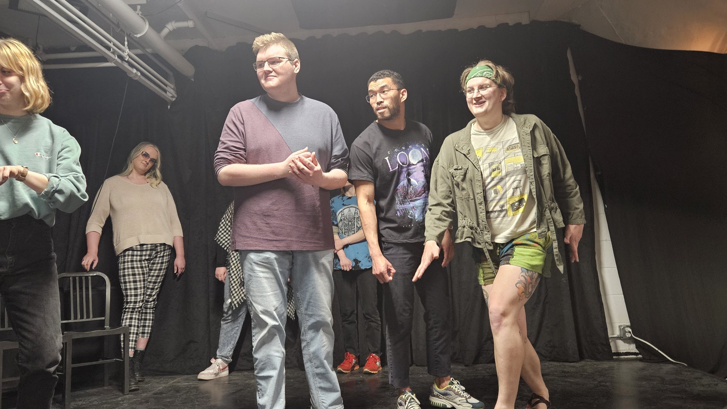 Photo of improvisers of all levels at our open jam, having fun as characters in scenes.