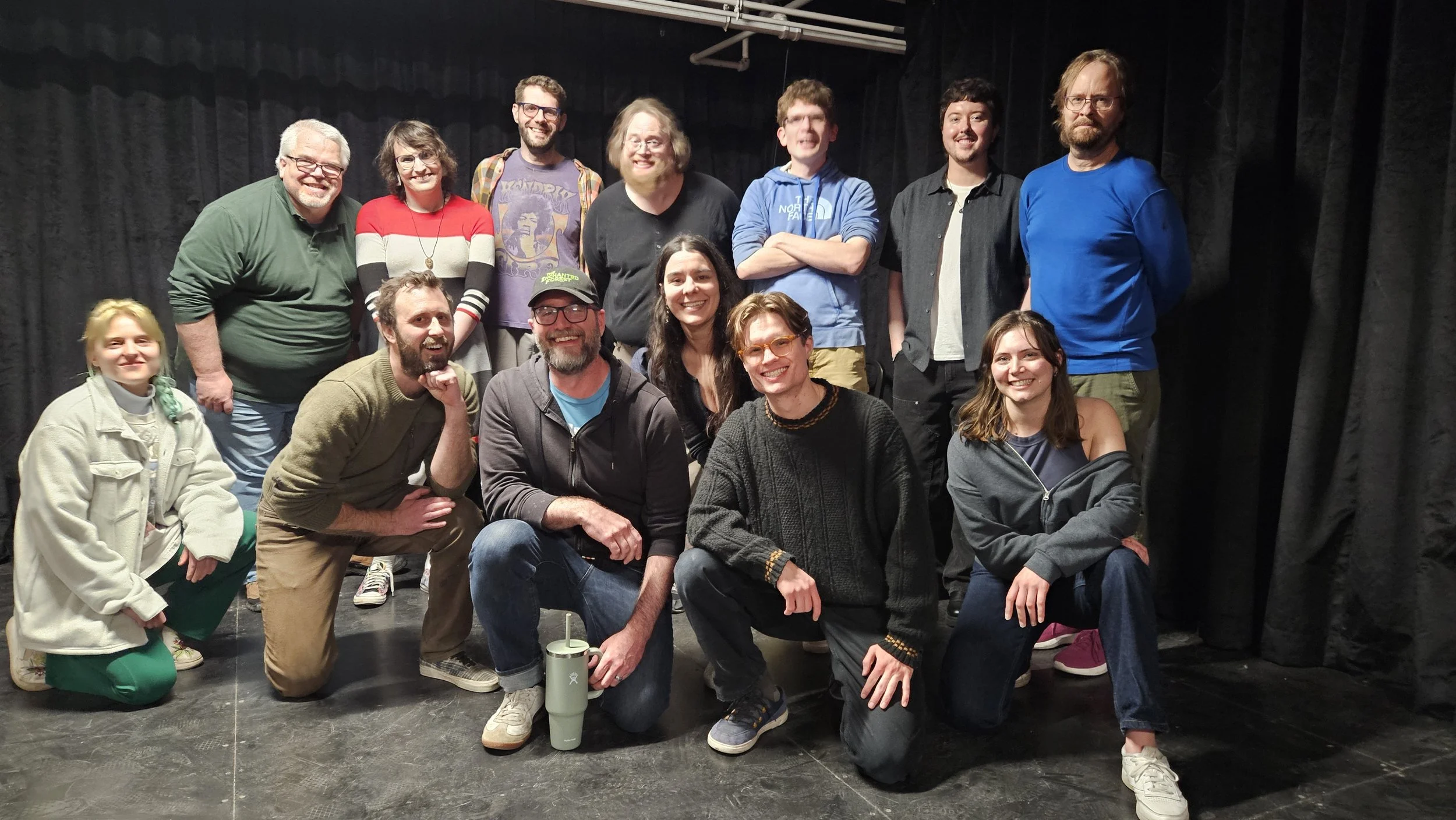 Photo of one of the groups at our open improv jam, smiling after a successful set!
