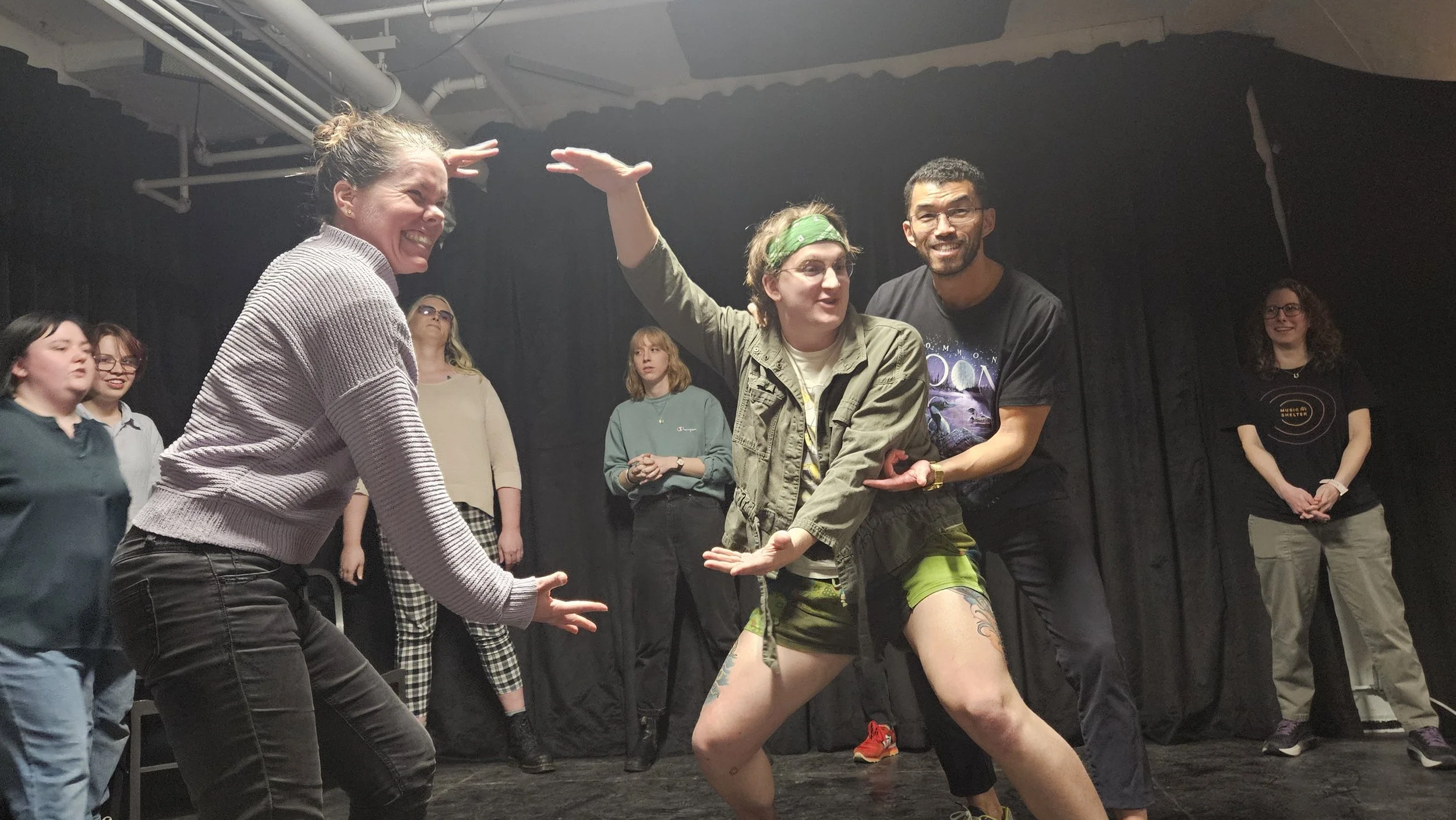 Photos of improvisers of all levels smiling and working together to create an interesting stage picture and story.