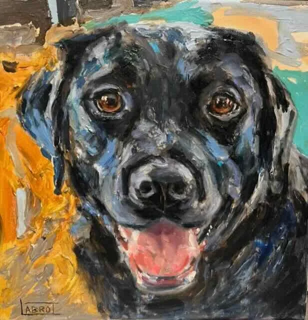 A colorful, impressionistic painting of a black dog with brown eyes and its tongue hanging out, sitting outdoors with foliage and a yellow structure in the background.