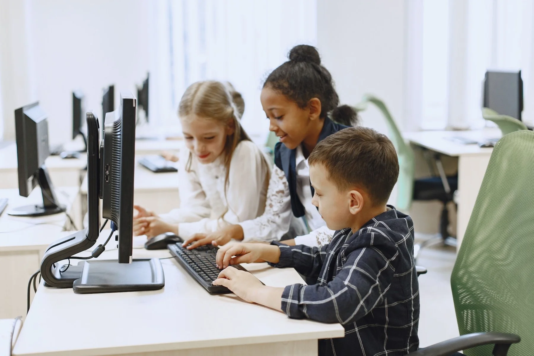 Kids working on computers in a classroom