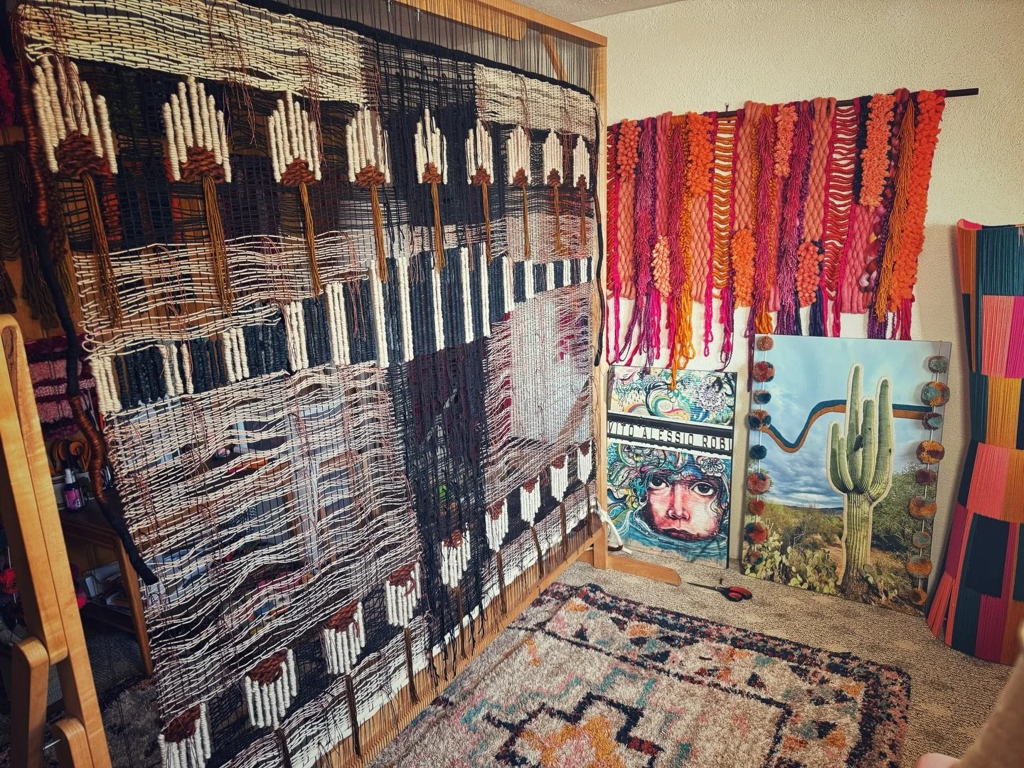 Studio scene. The weaving on my big loom is ready for her transformation.