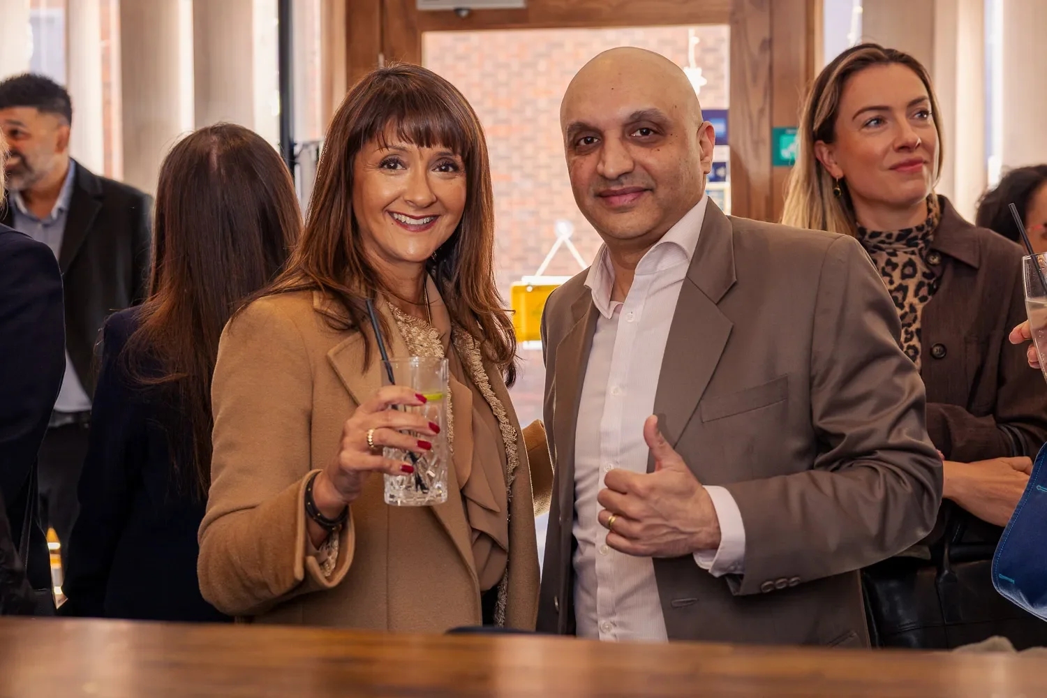 Two business professionals smiling at a Small Business Hub networking event in St Albans