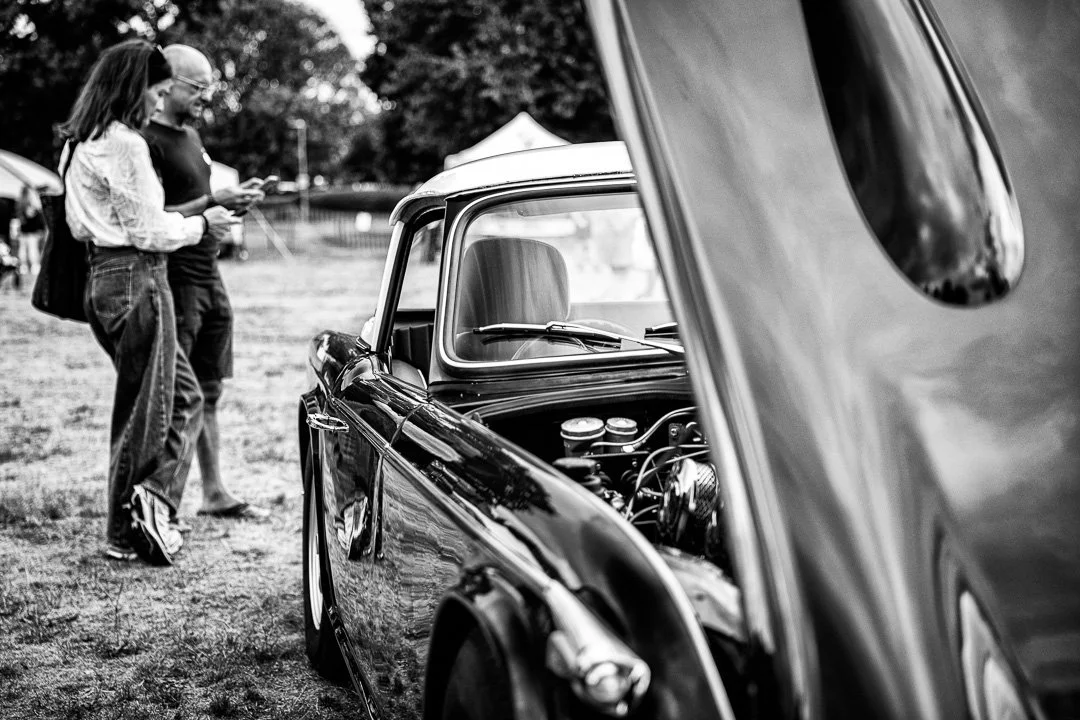 Two people lookingat a classic car.jpg