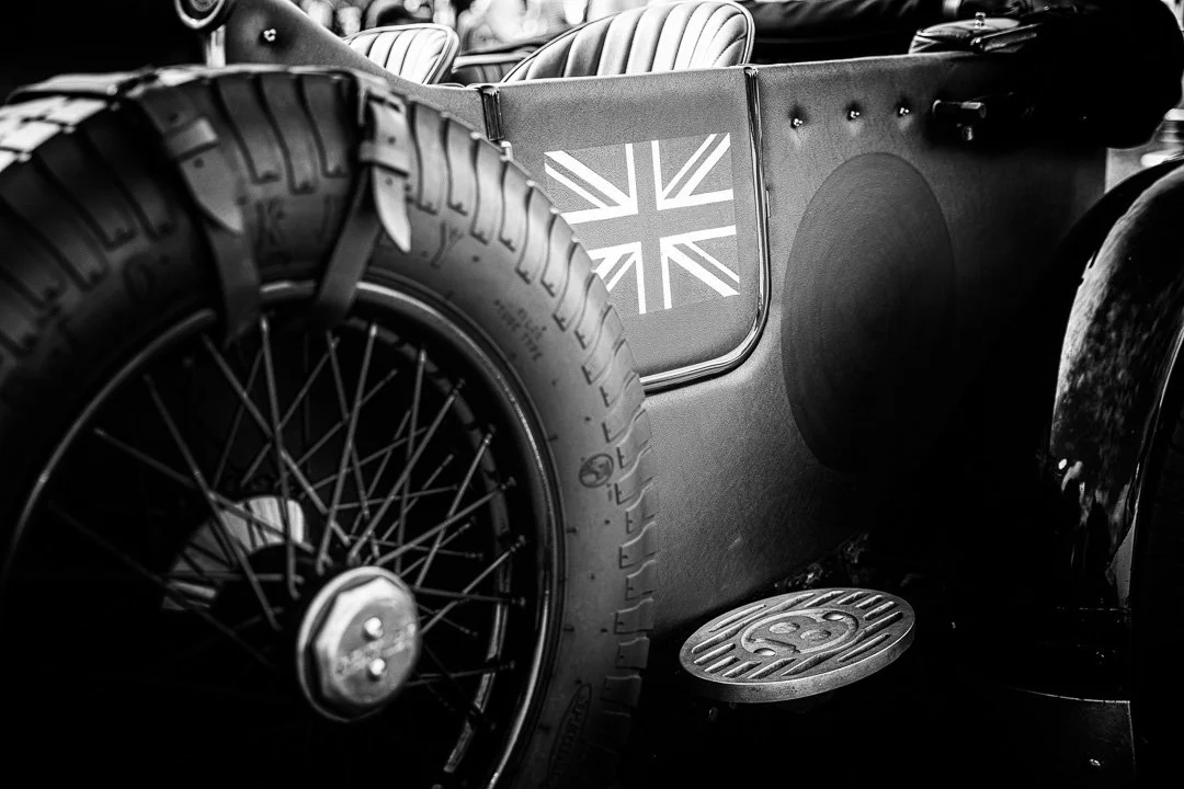 A side view of a classic Bentley with an image of the union jack on the door.jpg