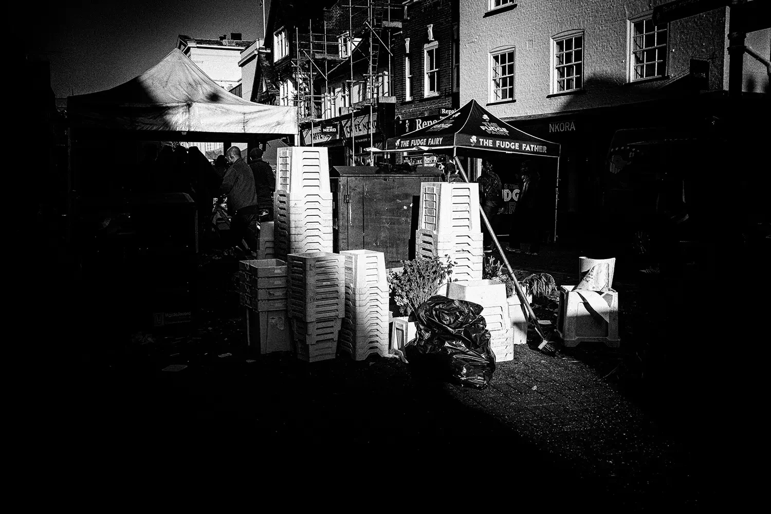 Plastic flower baskets in St Albans market.webp