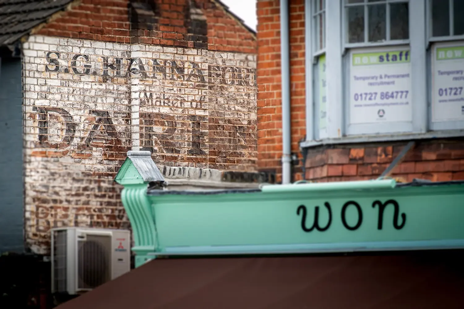 Old hand painted wall sign-St Albans.webp