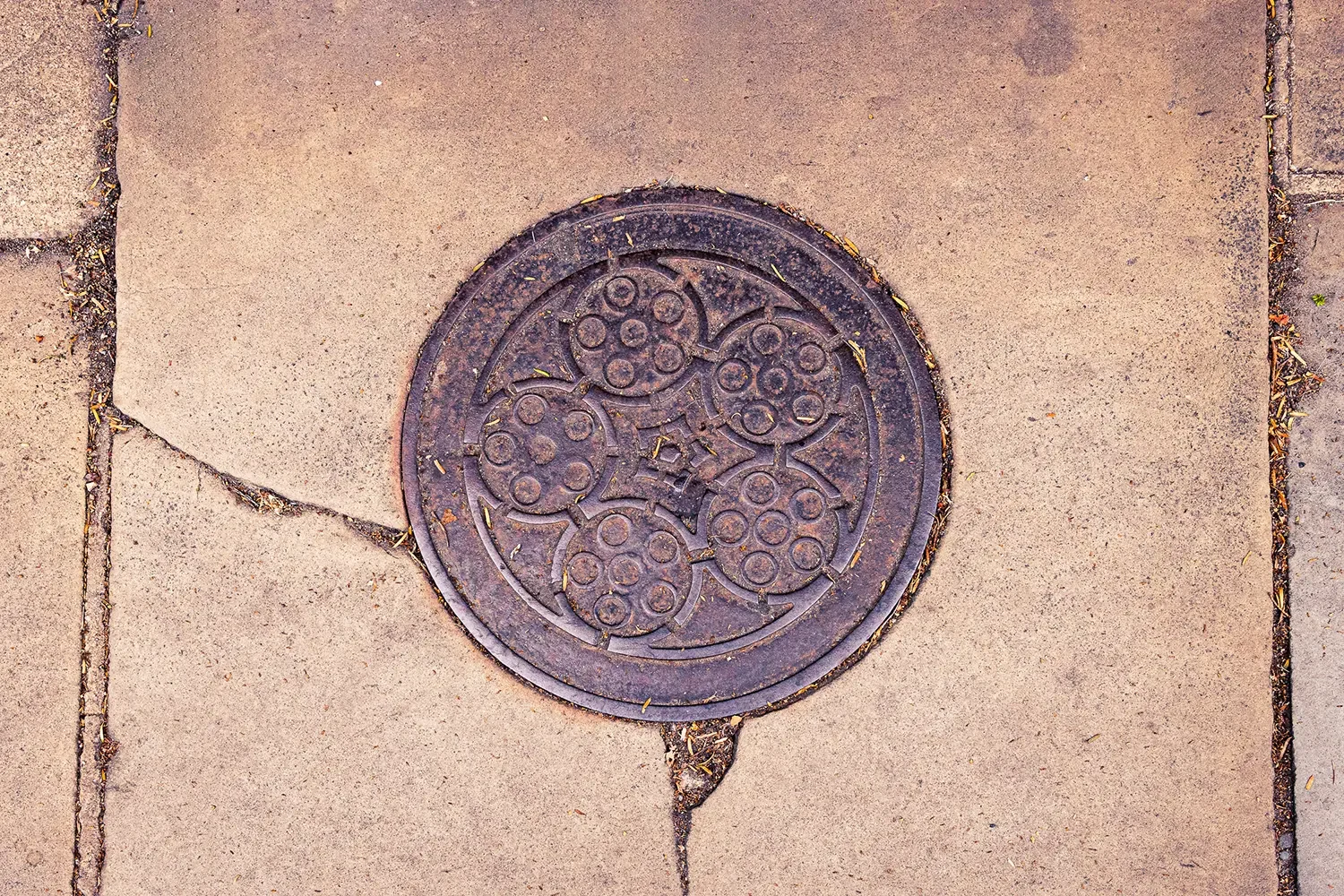 An ornate drainage cover-st albans.webp