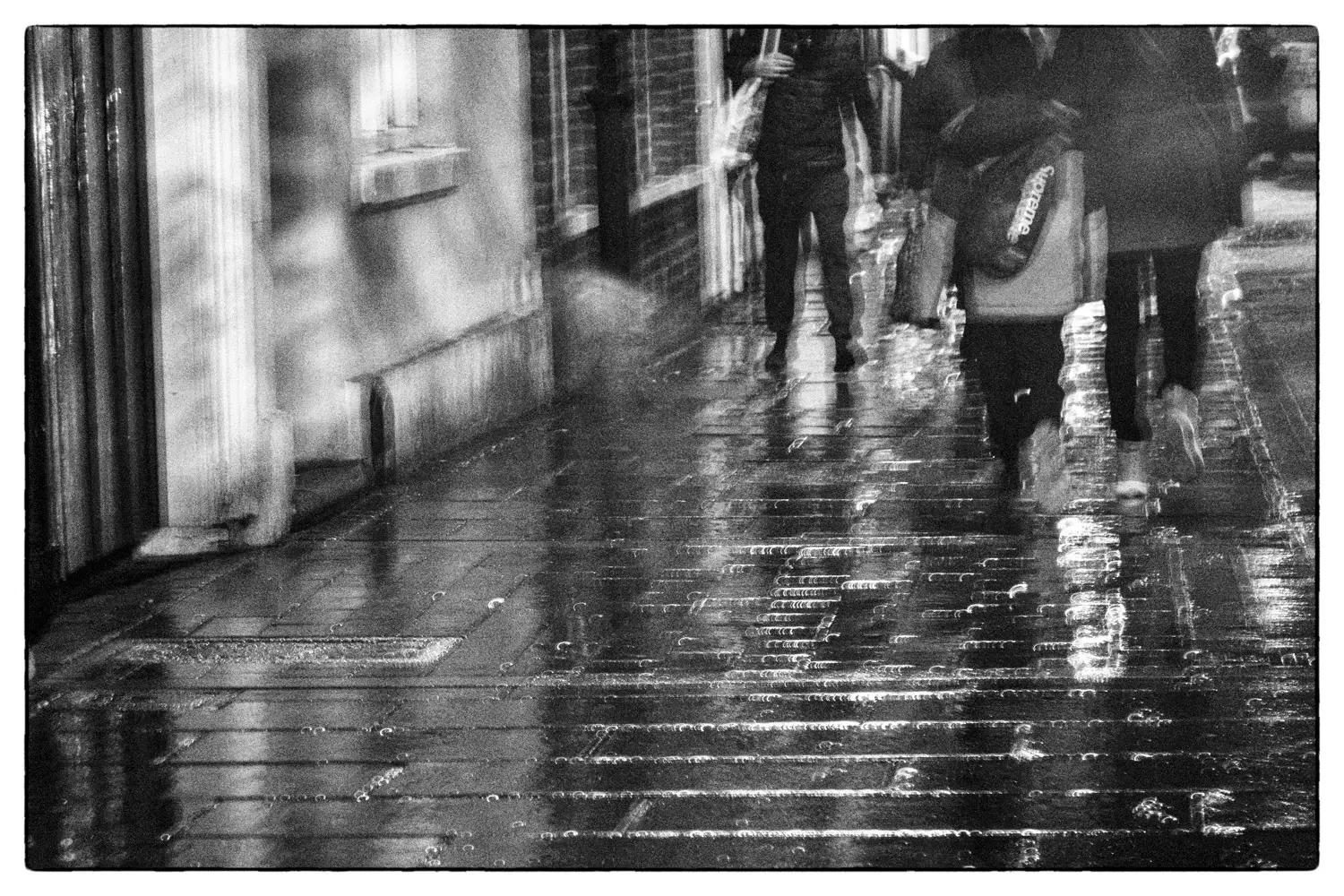 Wet pavements on a Christmas evening in St Albans.webp