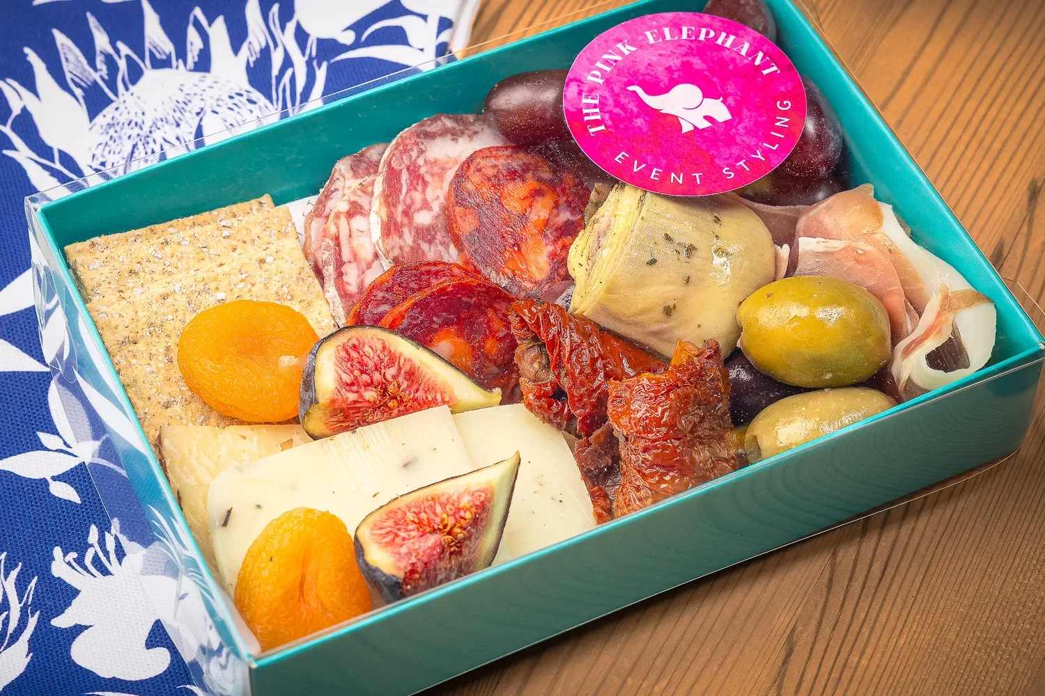 The Pink Elephant savoury charcuterie box — figs, salami, cheese, olives and sun-dried tomatoes, food photography St Albans