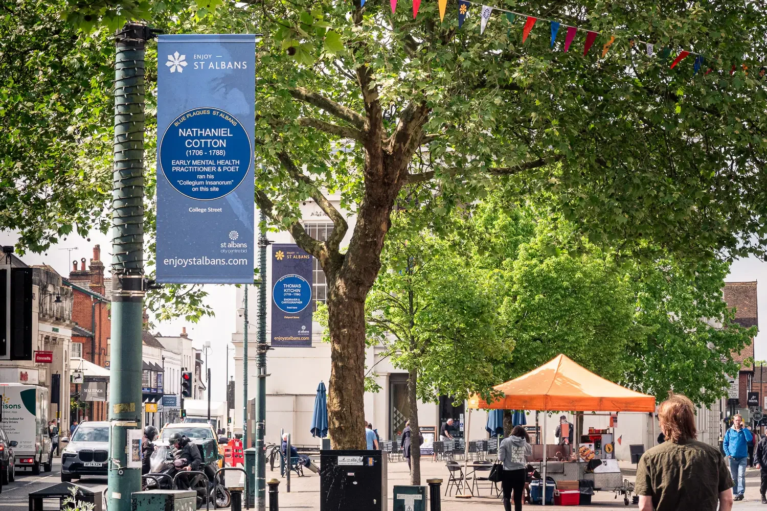 Blue plaque heritage banner for Nathaniel Cotton on St Peter's Street, St Albans