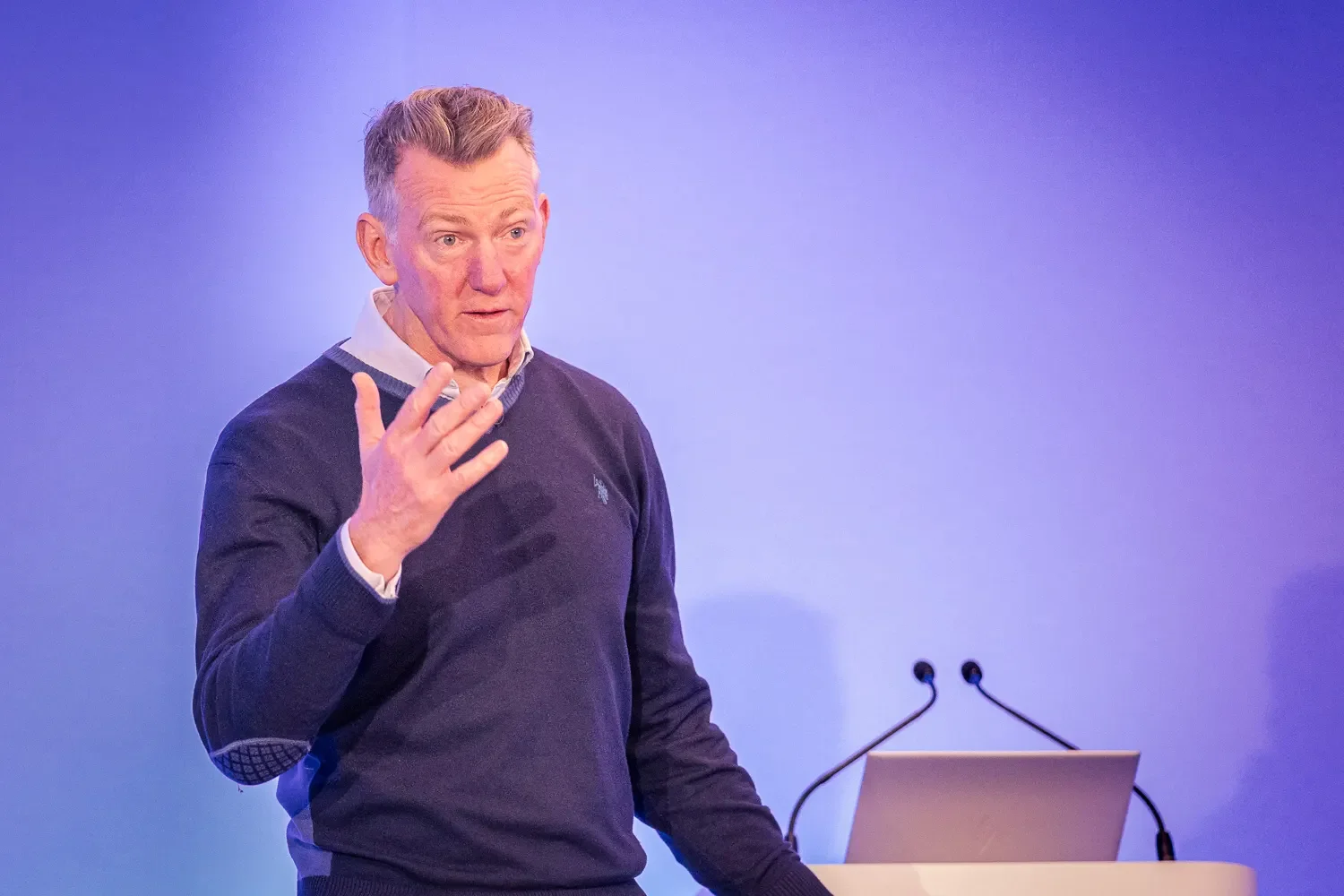 Portrait of Ben Hunt Davis, Olympic Gold Medallist rower on stage giving a keynote presentation at a corporate event, London
