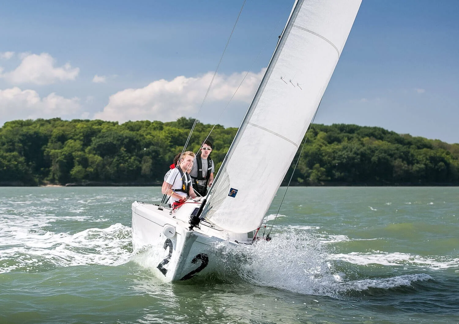 Yacht racing crew heeling hard on the water off Cowes, Isle of Wight