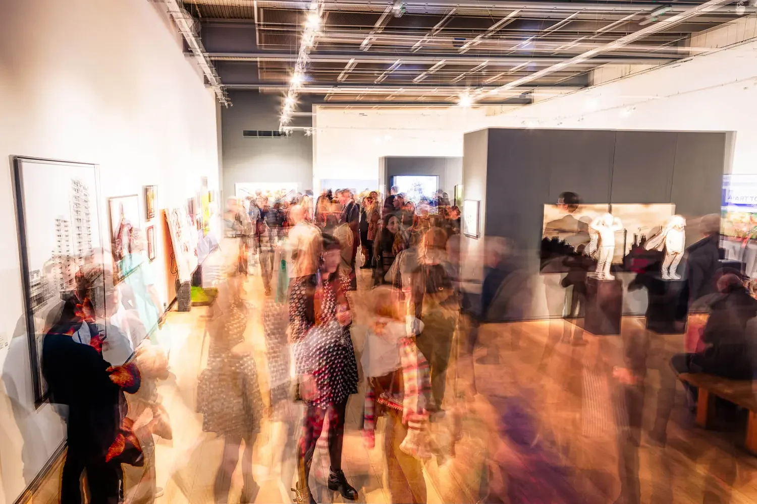 A male presenter talking to a corporate audience in an office environment.