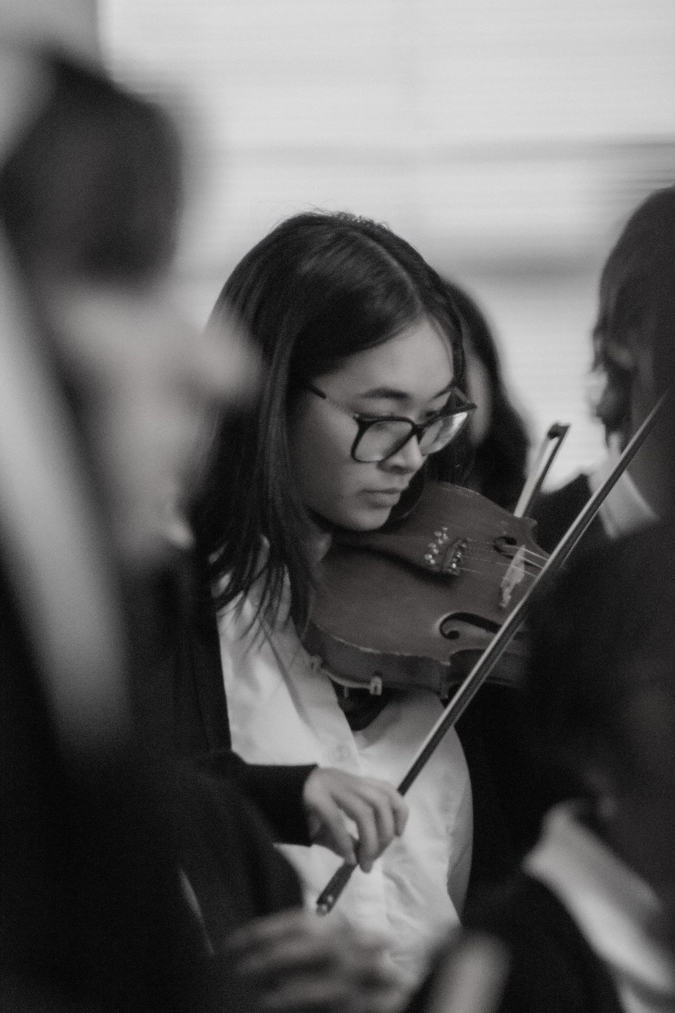 Young musician playing a violin in monochrome