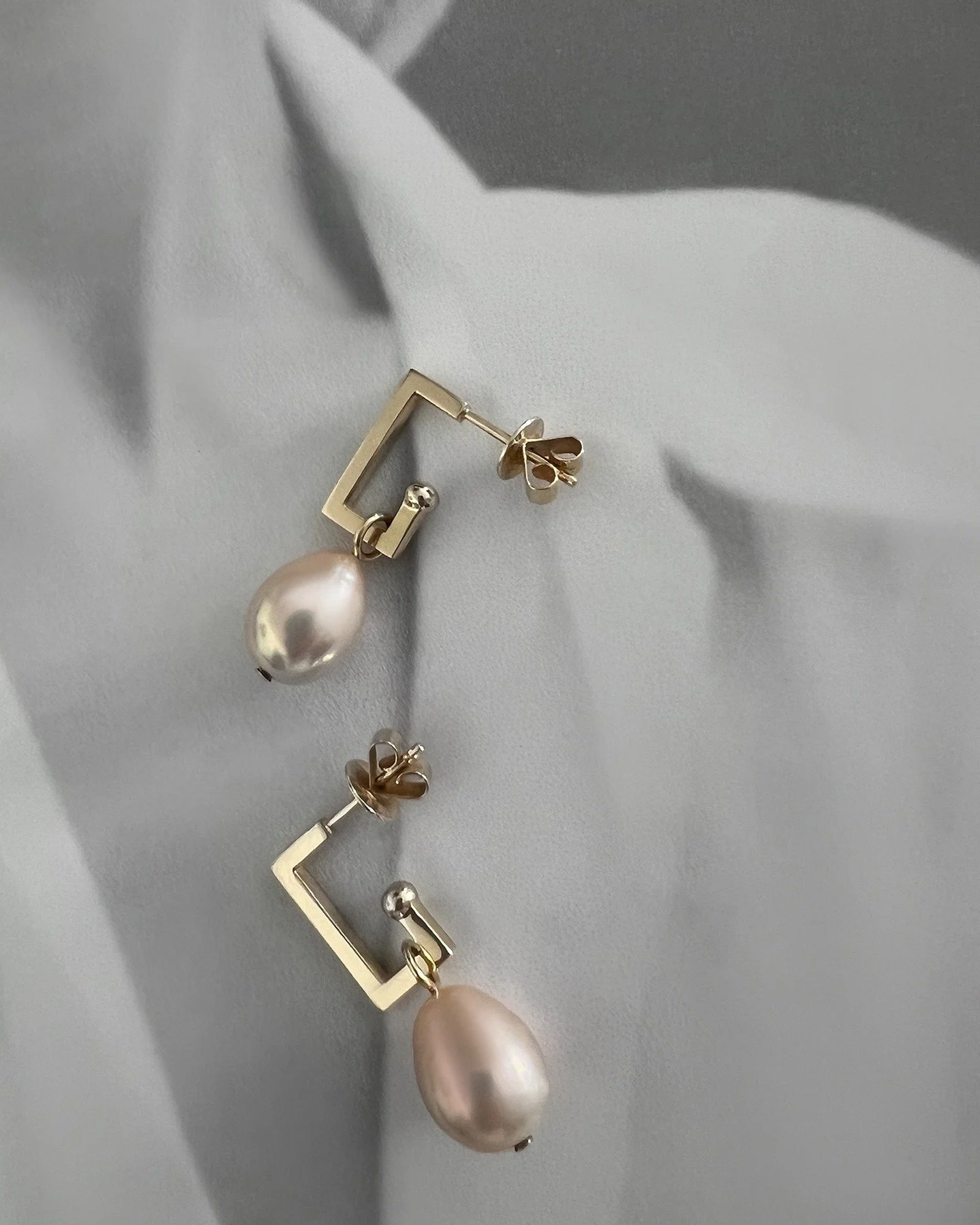 Pearls that feel like morning light,
simple, modern, and meant to stay with you.

Pick the one that whispers your name. Paired with Maison Lipowa signature huggie earrings in solid 18K yellow gold. 
Always made by hand. Always sleek &amp; effortless,