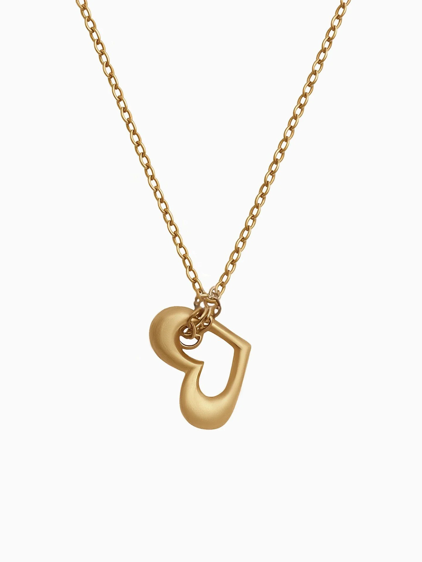 Solid gold heart necklace, simplified to its essential form.
Soft curves. Structured volume. A modern heirloom in 9k gold.

Fine jewellery designed for everyday wear &mdash; understated, sculptural, lasting.

#goldheart 
#solidgoldnecklace 
#finejewe