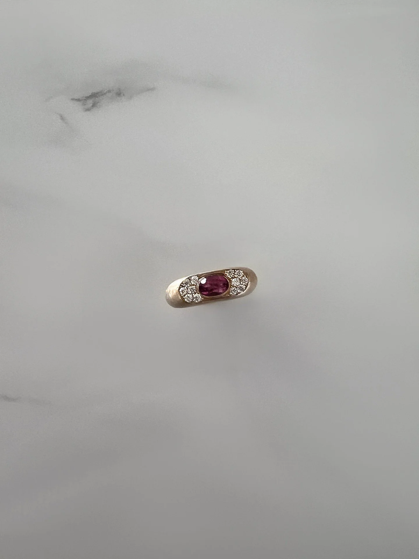 Pink sapphire set in gold &mdash; worn close, for yourself.

Designed for the pinky, or to rest on a chain.
.
.
.
#finejewellery
#pinksapphire
#goldjewellery
#modernheirloom
#jewelleryeditorial