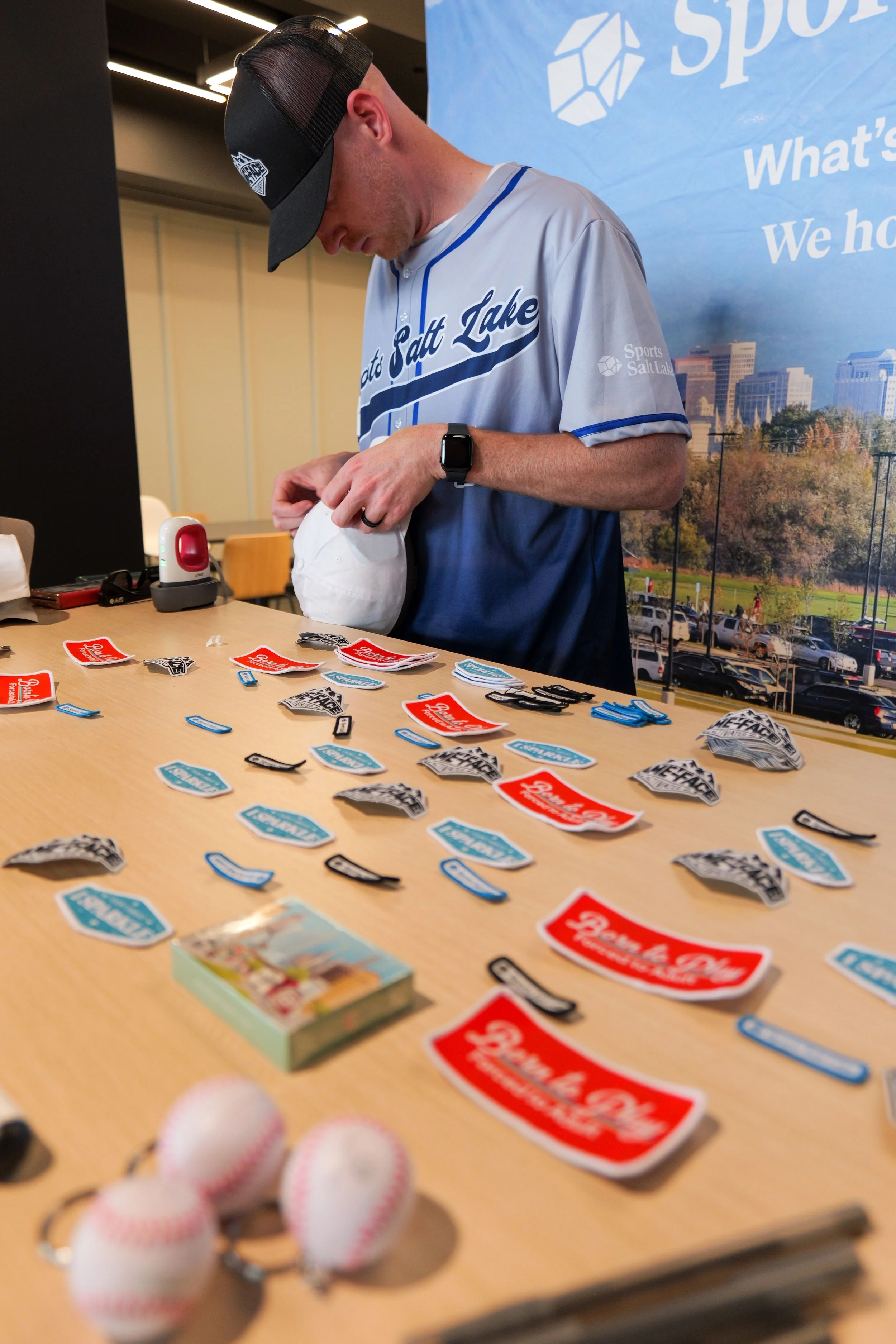 A look at one of the merchandise booths at the Sports Salt Lake Summit event. Enticer Media photography Salt Lake City, Utah.