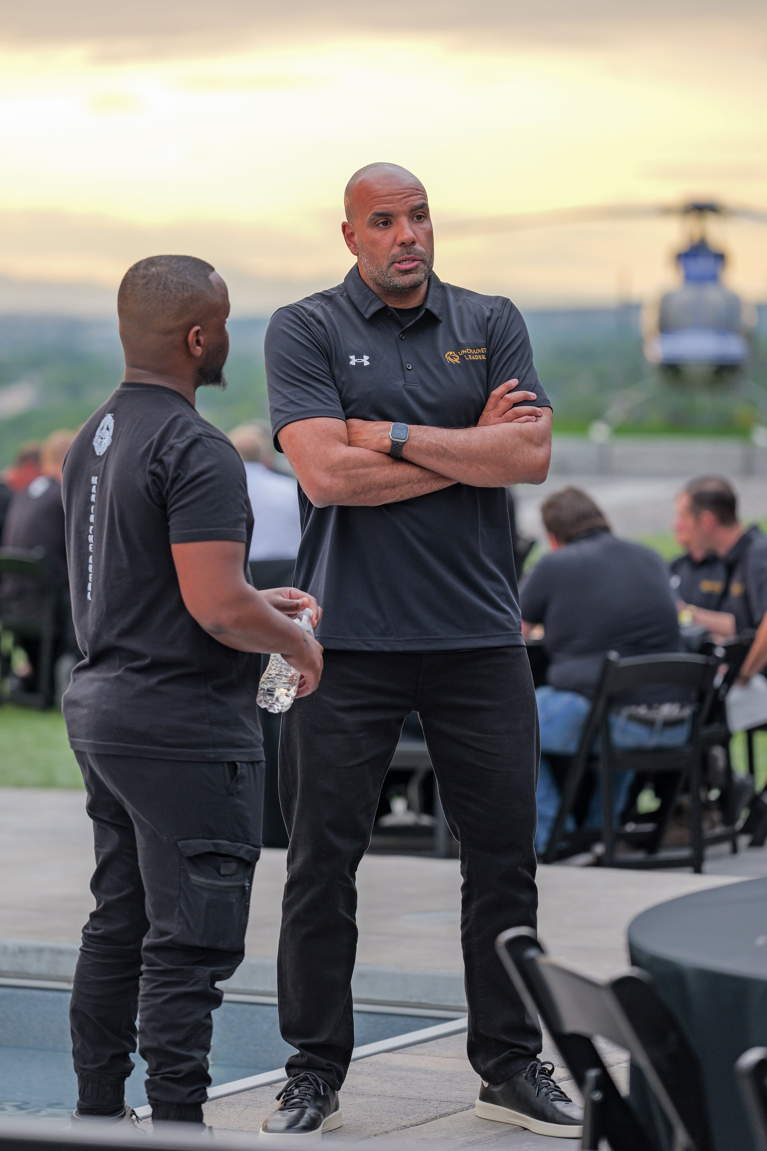 Membersr of the Unchained Leader team talk at a conference event in Utah. Enticer Media photography Salt Lake City, Utah.