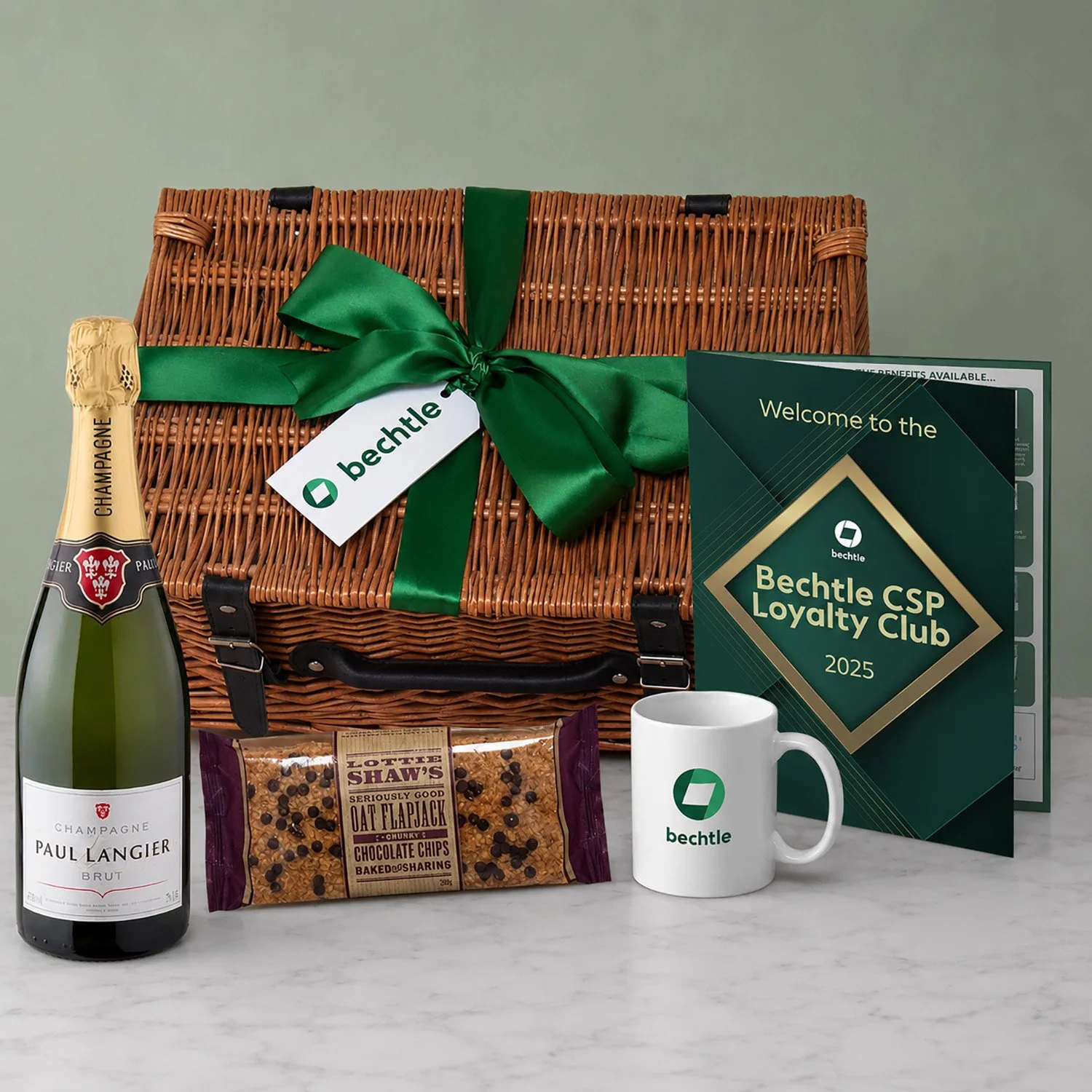 Branded Corporate Hamper in Wicker Basket with Champagne, Flapjack, Branded Mug & Folder for Bechtle