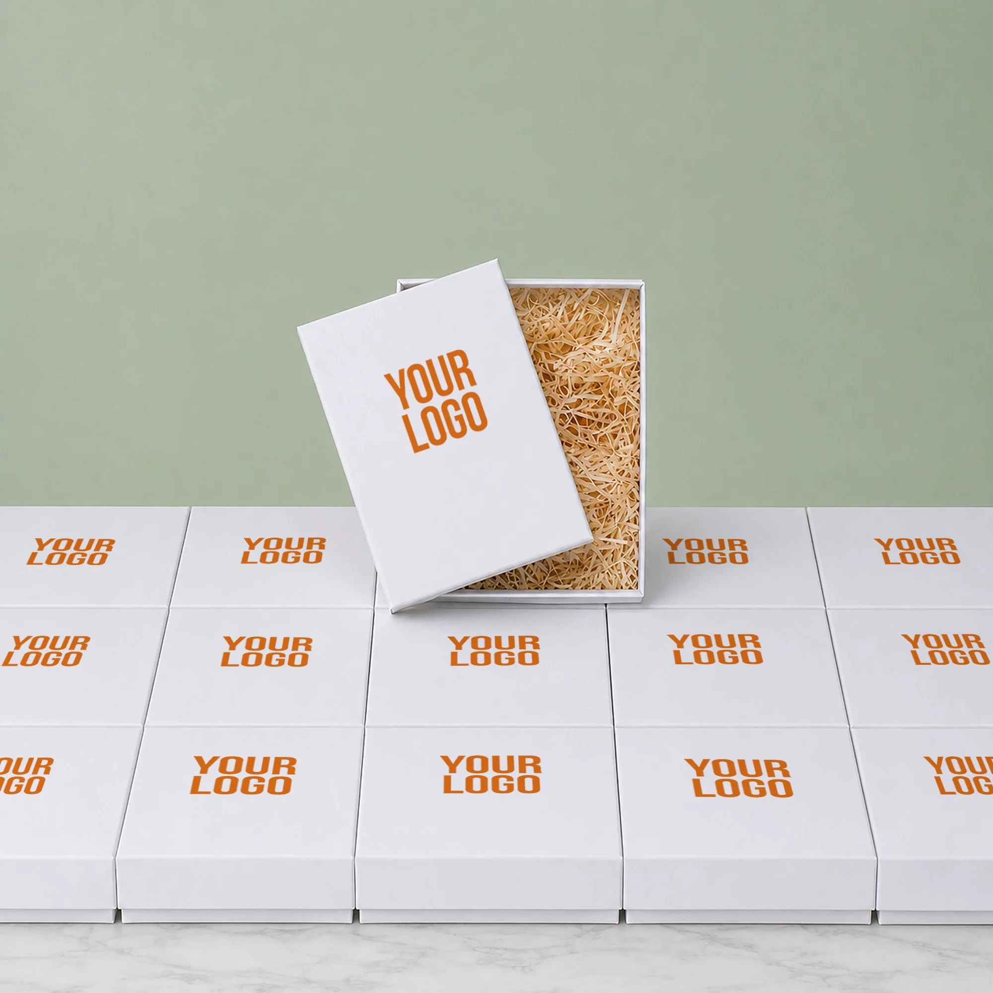 Branded corporate hamper boxes arranged at scale with one open gift box showing packing shred.