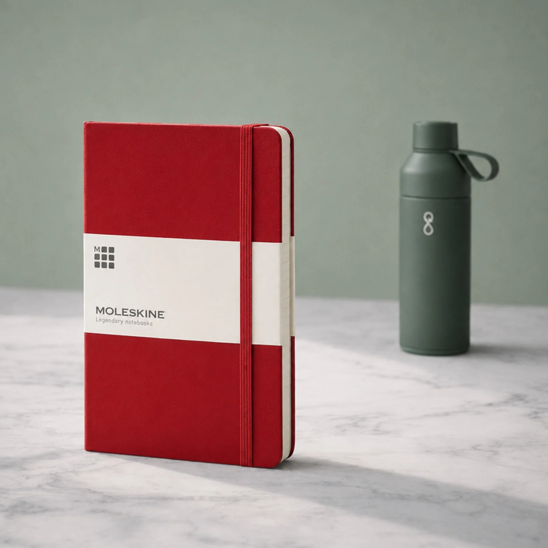 Example branded merchandise for christmas hampers including a notebook and bottle.