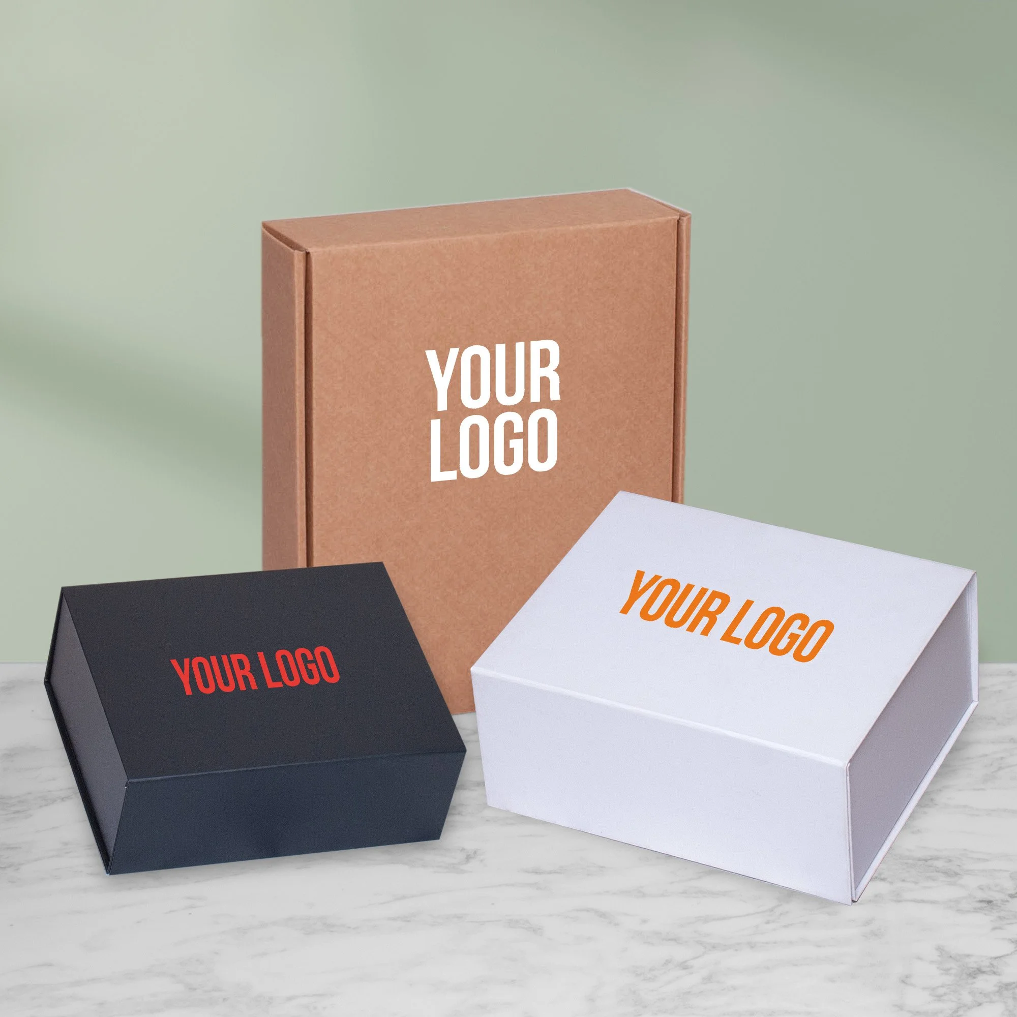 Branded gift boxes in kraft, white and black with custom logo printing for corporate hamper packaging