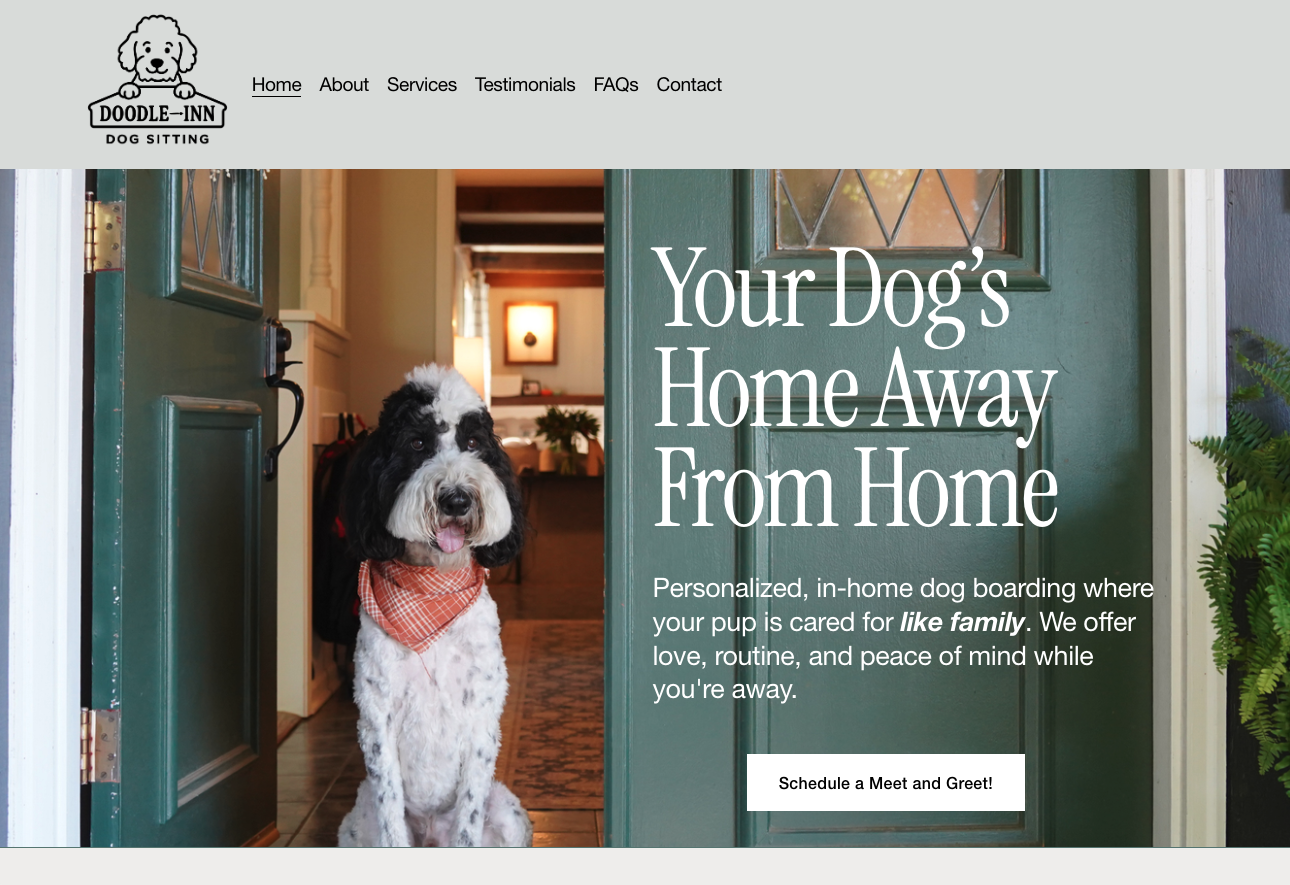 A dog with black and white fur sitting inside a home, looking out the door, wearing an orange bandana, with a welcoming sign on the website webpage for a dog boarding service called Doodle Inn.