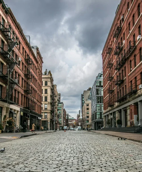 Cobblestone street and historic loft buildings in the Tribeca neighborhood of Manhattan, New York City.