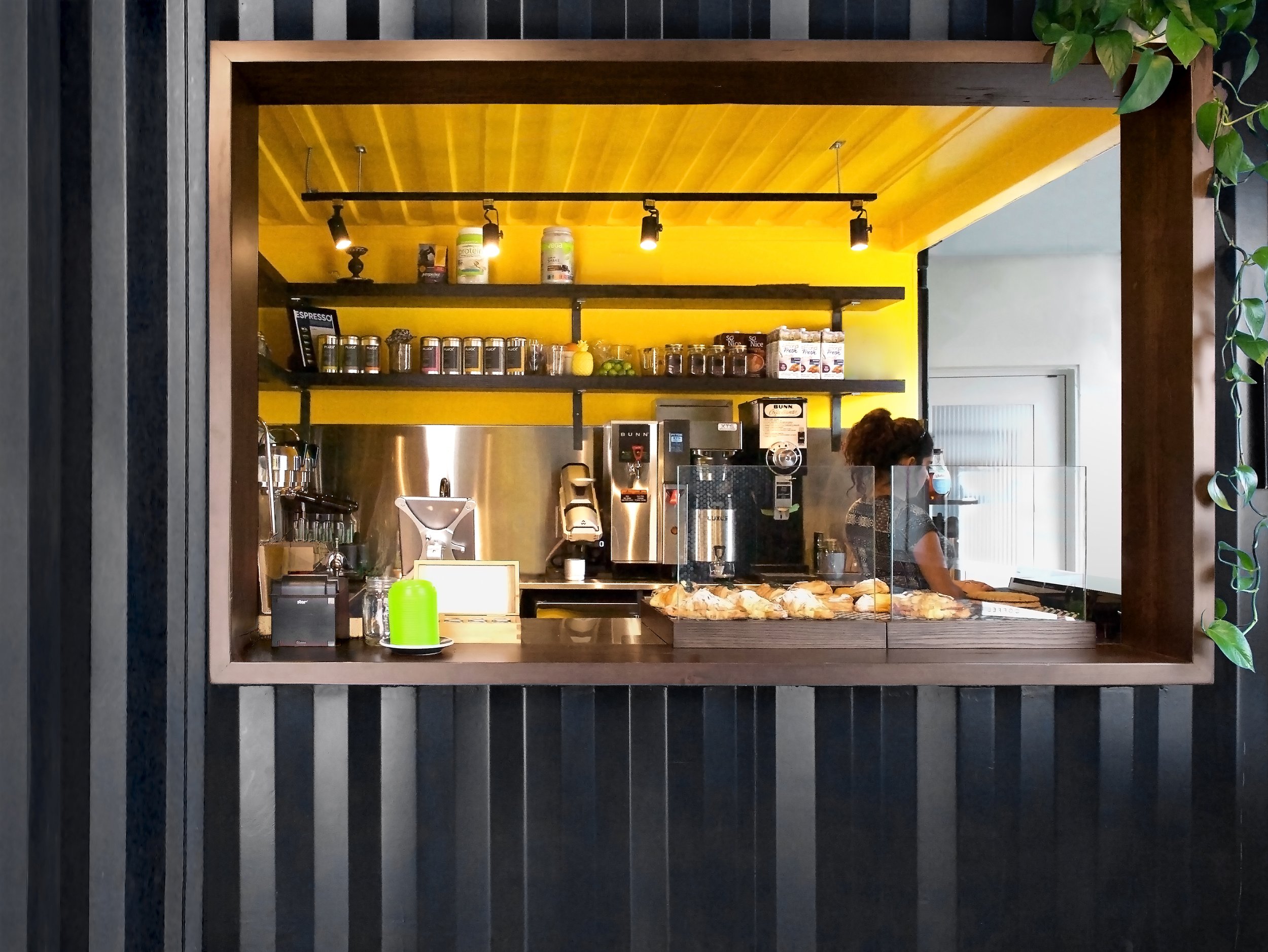 Alcove Coffee Shop by These Architects located in Toronto internal shipping container customer counter