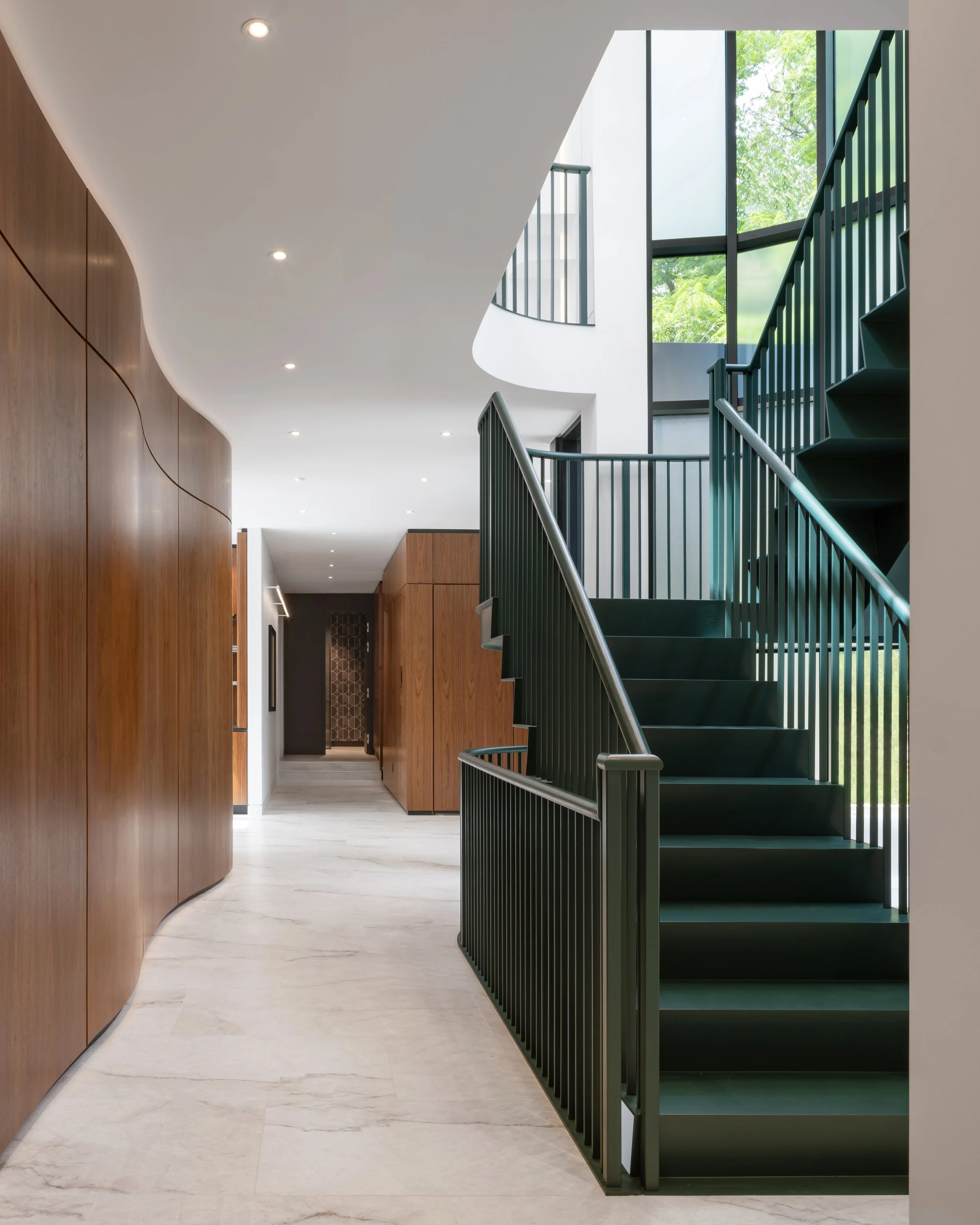 House in the Hill custom green staircase and millwork by These Architects