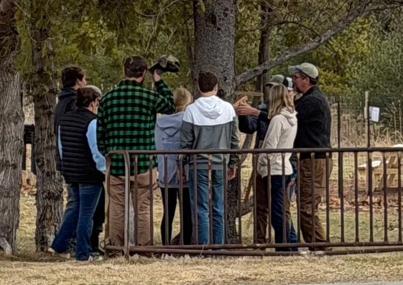 Students measuring a tree