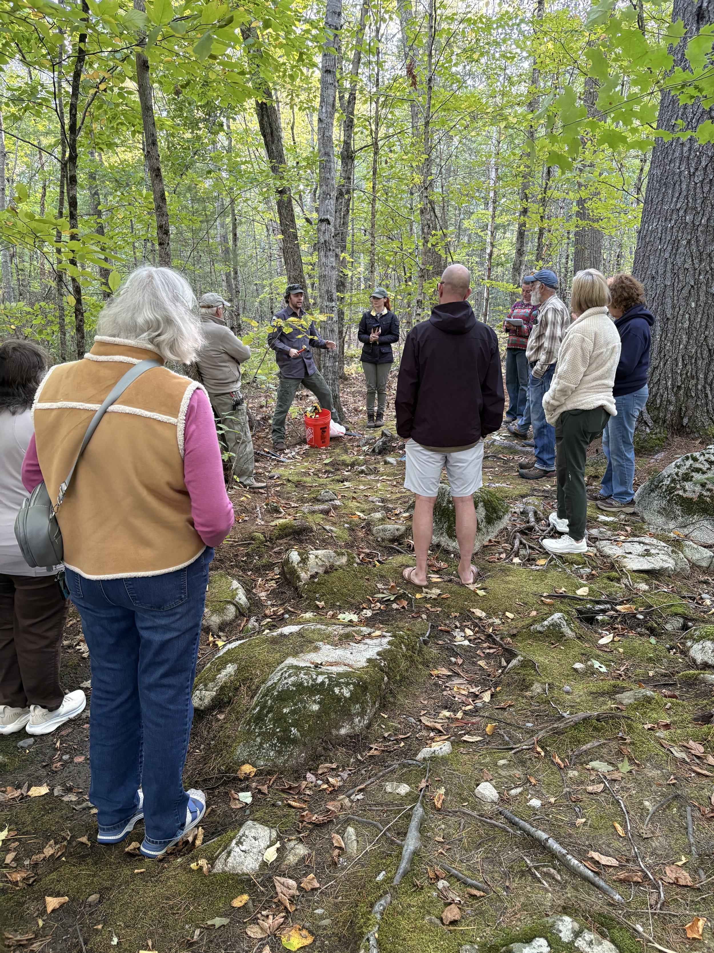 Attendees learning about live staking