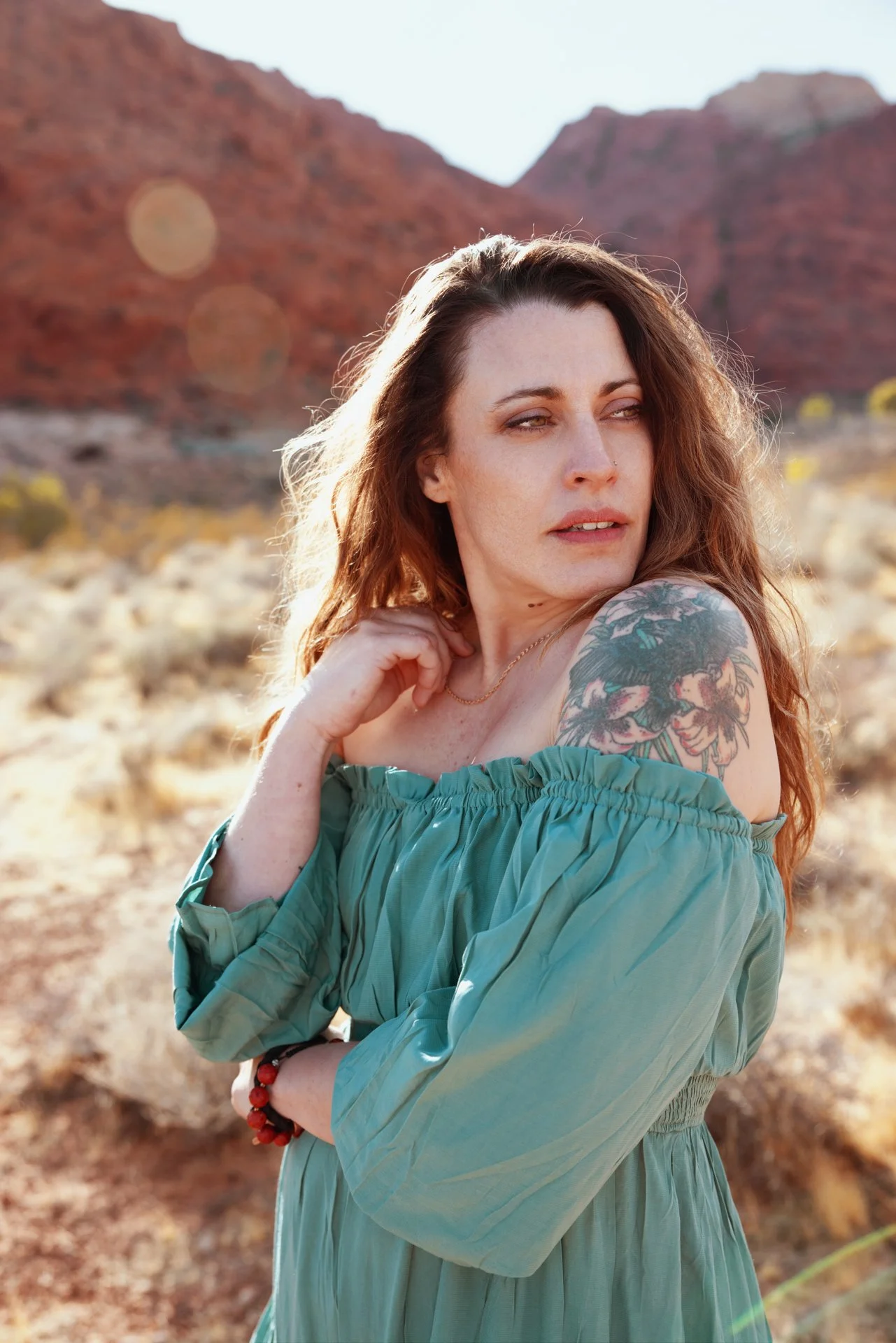 desert-portrait-smiling-woman-green-dress-nevada.jpg