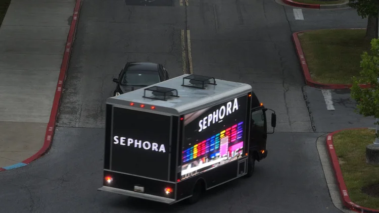 Digital LED billboard truck displaying a Sephora ad turning a corner