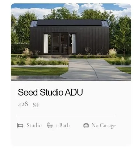 Front view of the Seed model ADU from MOMO by Luxmod, with solar panels on the roof, surrounded by trees and a landscaped yard, with a path leading to the entrance.