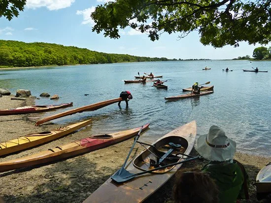 Kayakers Meet at the Beach
