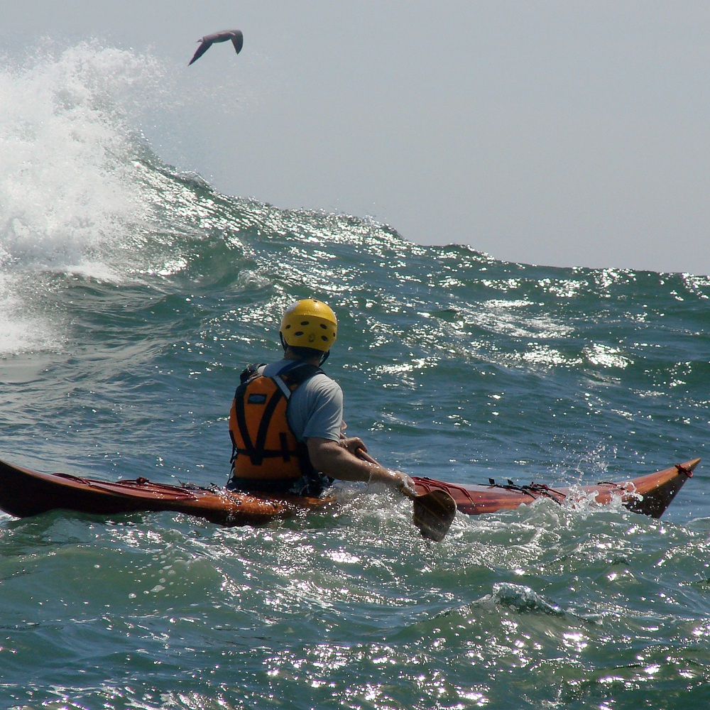 Paddling the Petrel near Catumn Rock on a big day