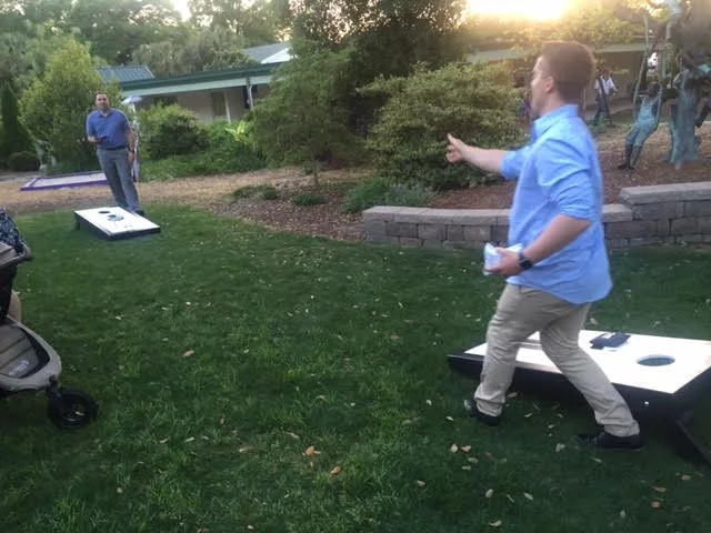 Brian &amp; Josh &nbsp;(hubby of photgrapher Wynona Benson) trying out the new corn hole set at the Bridal Mixer