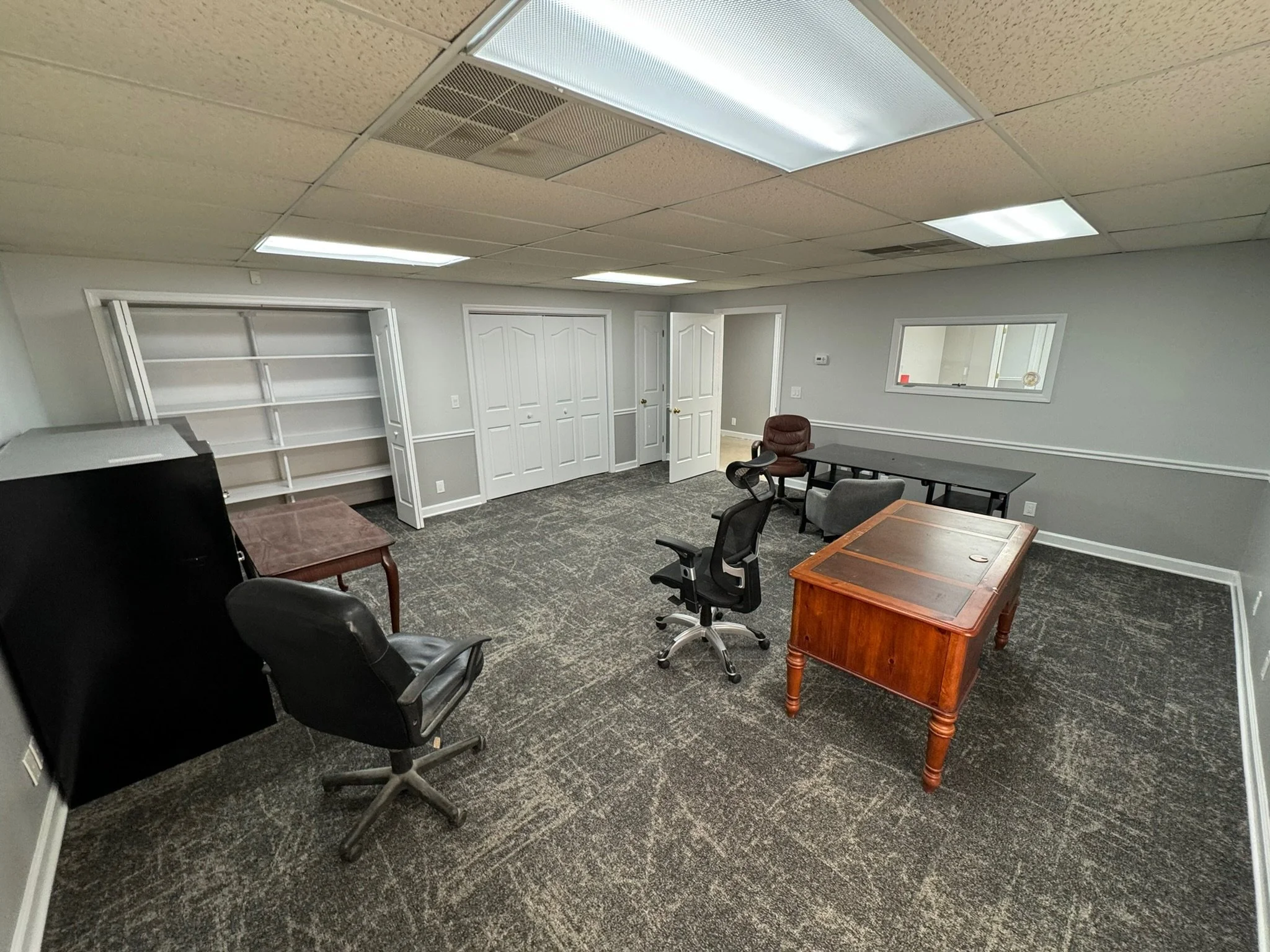 Warehouse office upgrade - fresh paint throughout, lighting upgrades, and new carpet tile flooring. 