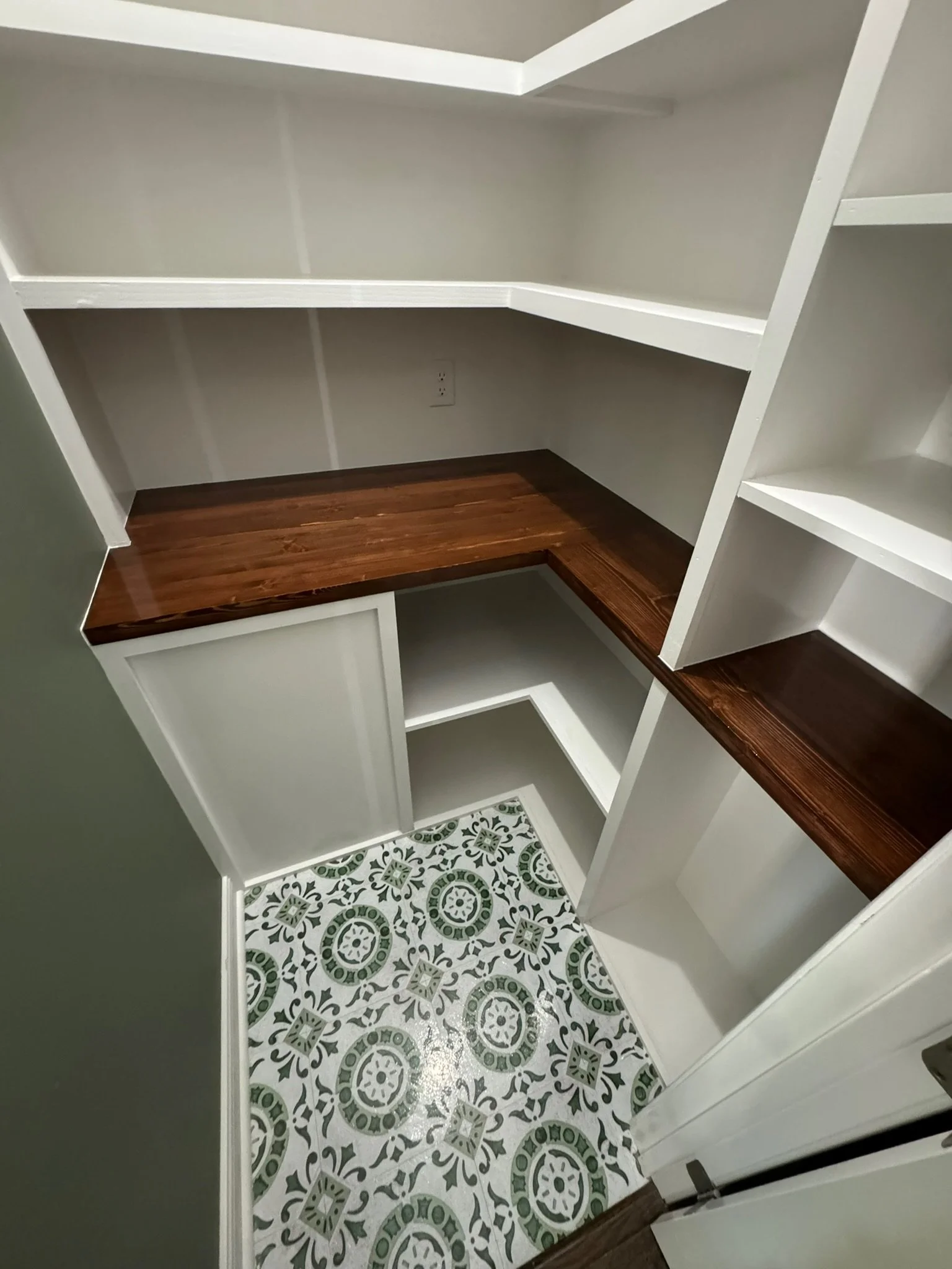 Custom pantry/coffee nook - custom shelving, butcher block countertop, crown moulding, lighting, paint, stain + varnish, and flooring. 