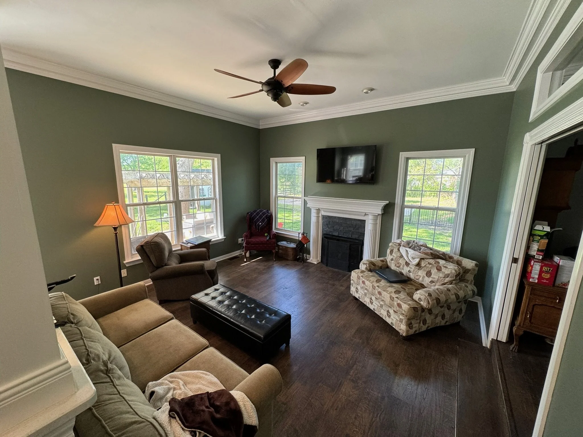 Color-change repaint from dull neutrals to a lush green, with crisp white trim.