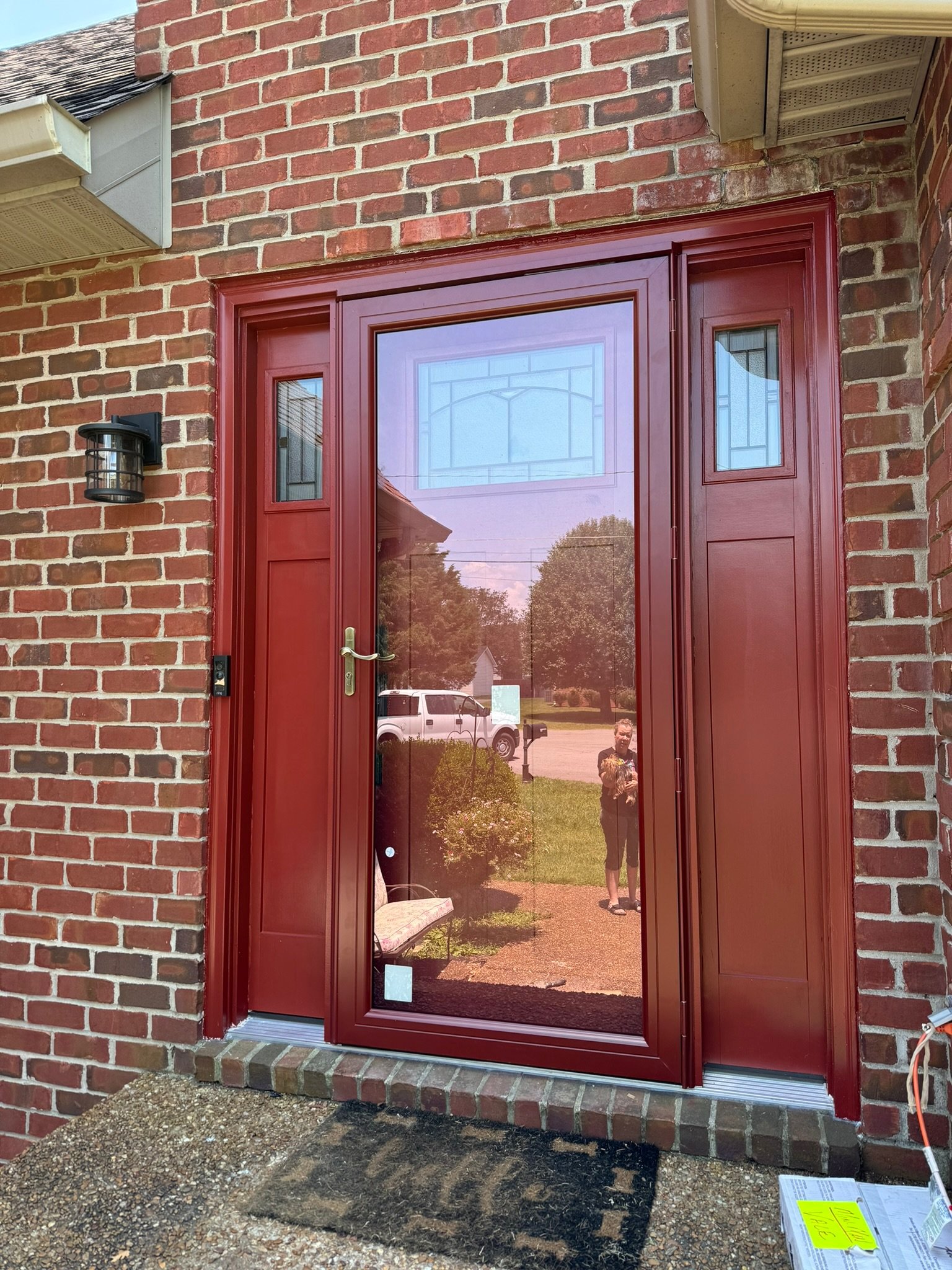 New door assembly with sidelights, painted to match the new storm door. 