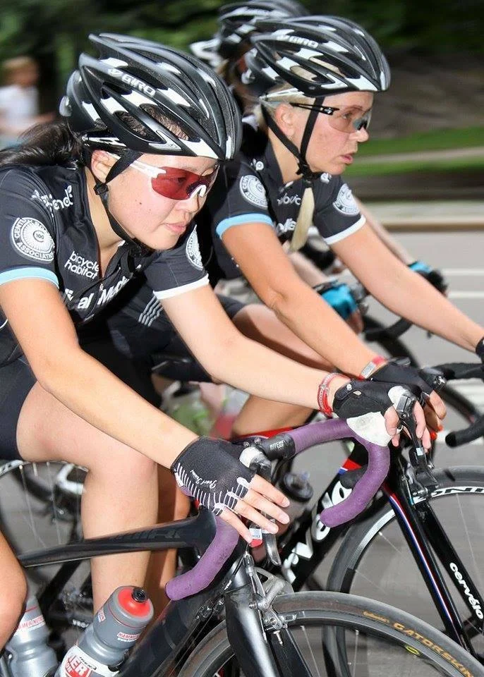 Cyclists in race with helmets and gloves