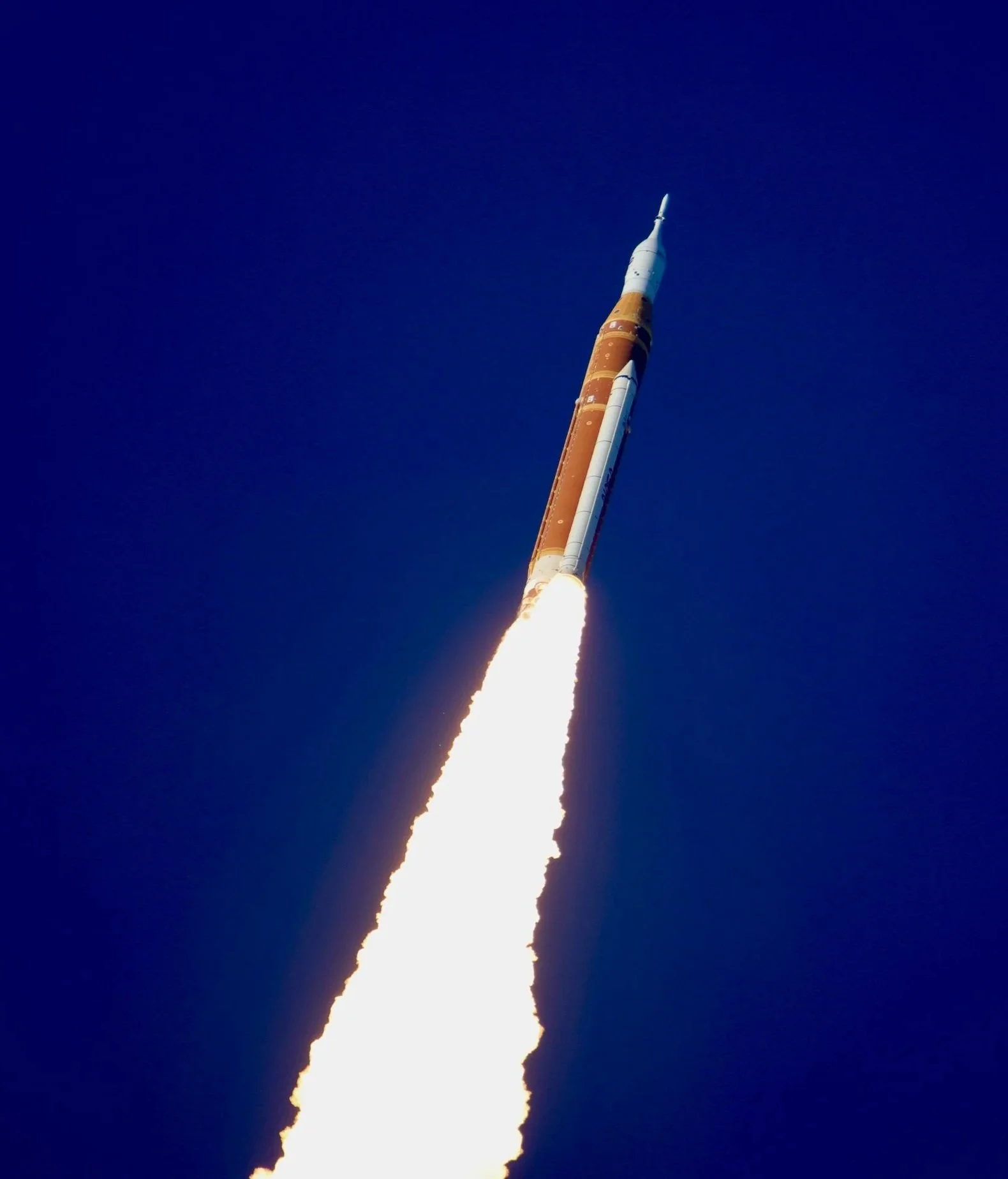 NASA Artemis II SLS rocket launching into the sky